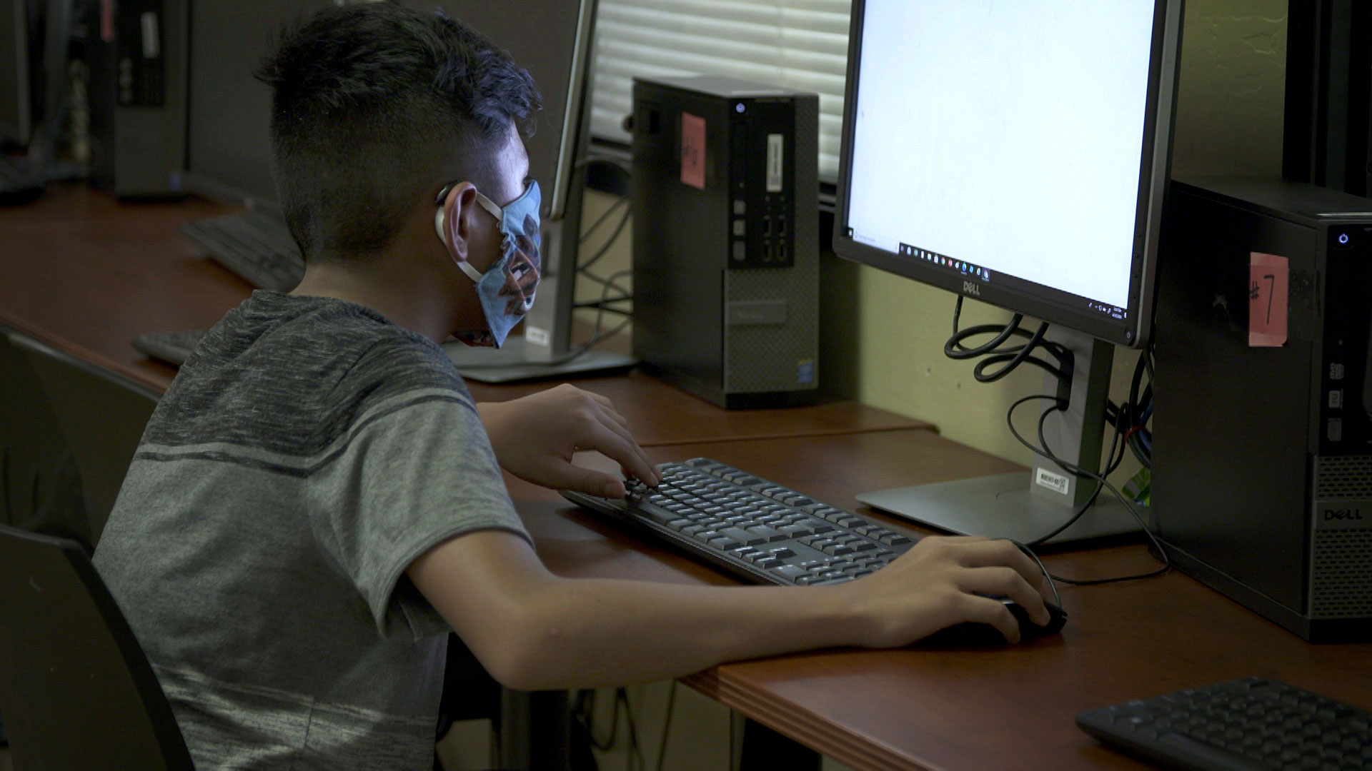 A boy uses the computer lab at the nonprofit Chicanos Por La Causa in Phoenix on August 24, 2020. 