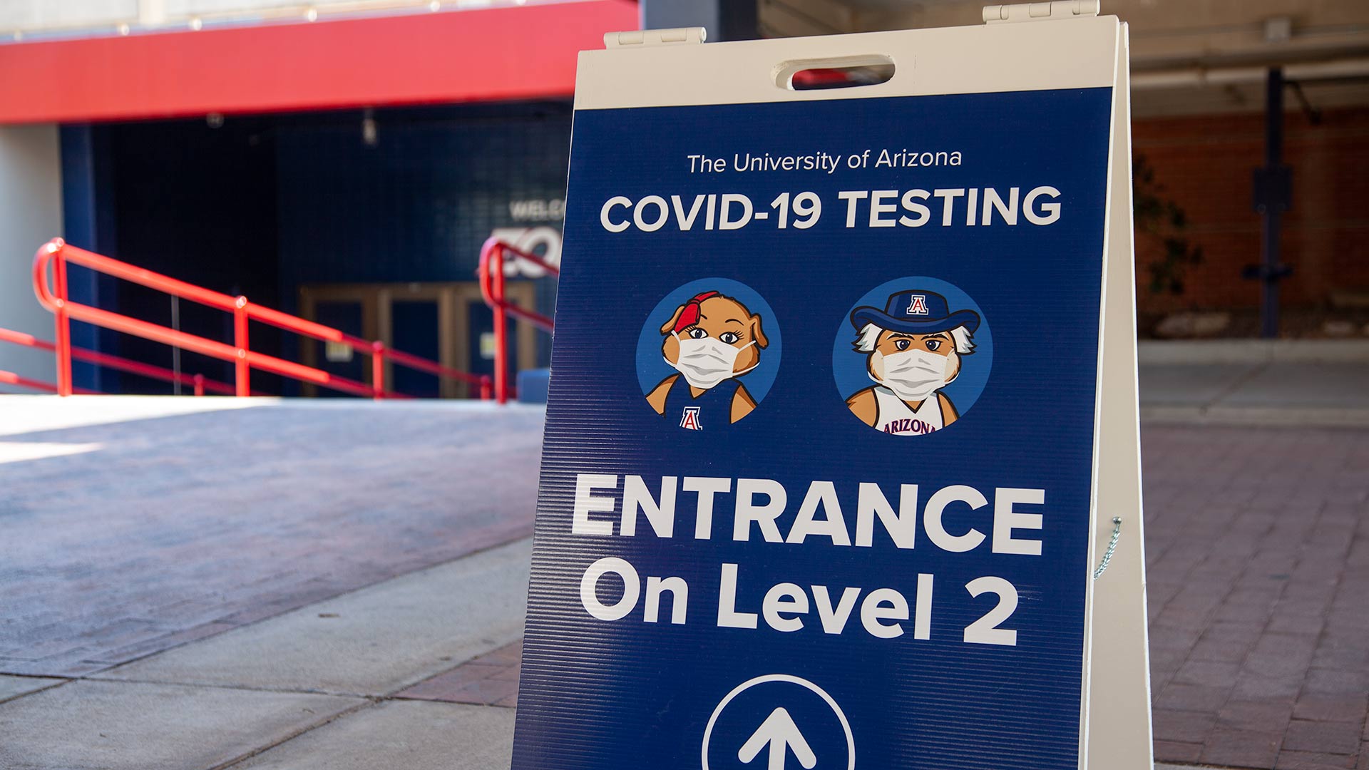 A sign on the campus of the University of Arizona directs visitors to a COVID-19 testing site, August 2020.