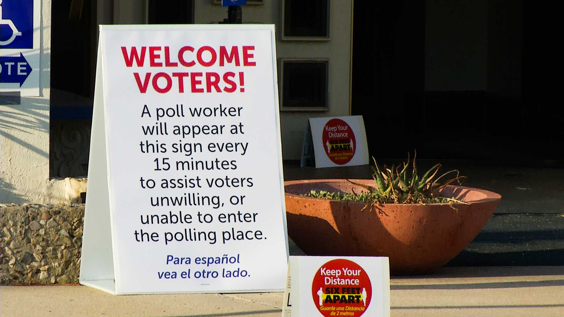 A sign instructs Pima County voters casting their ballots on primary election day, Aug. 4, 2020.