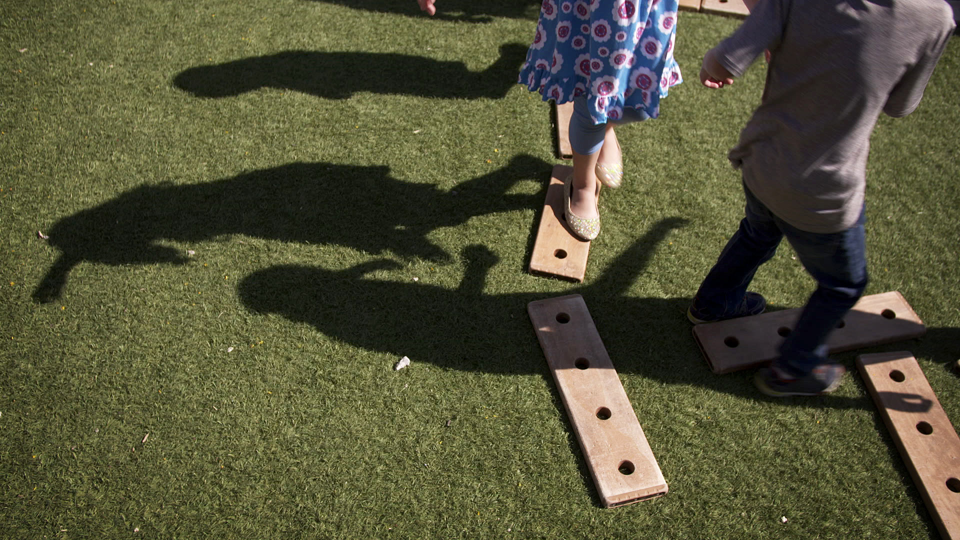 The shadows of children playing outside at a school in Tucson. 