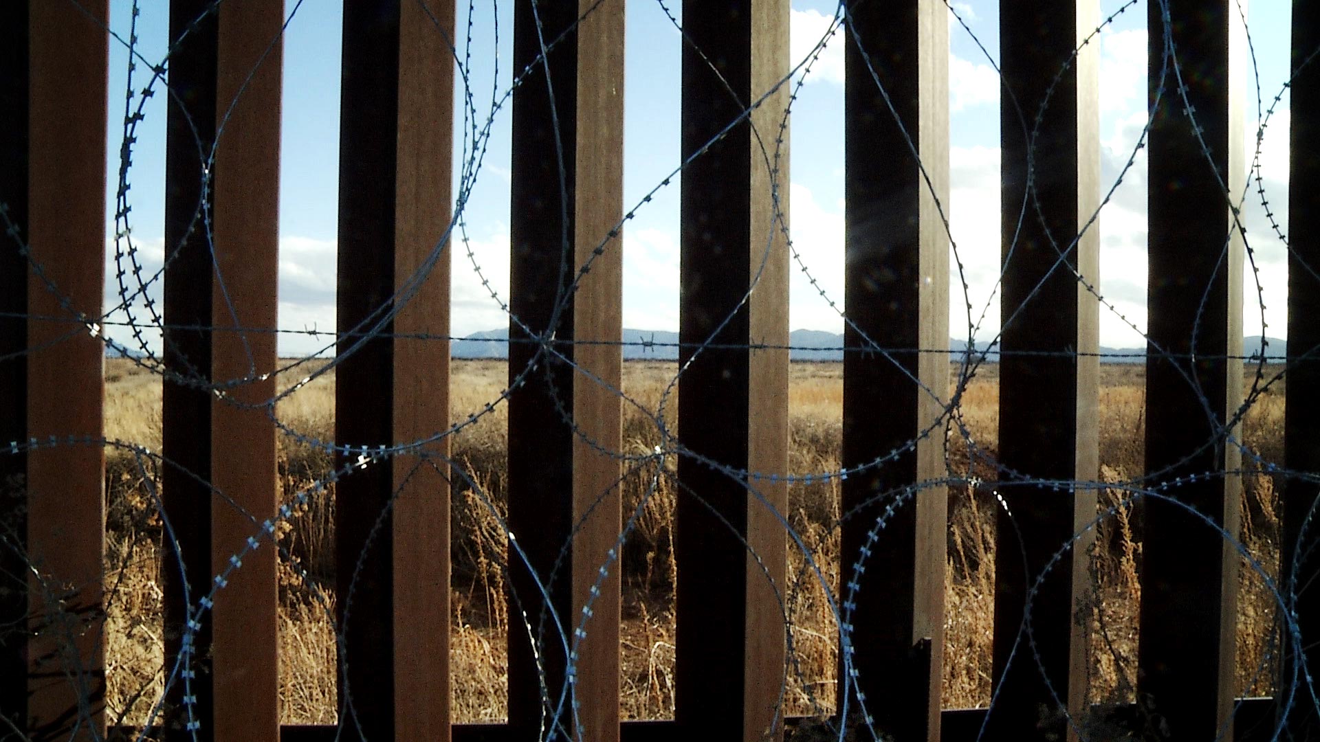 Border wall fencing with concertina wire attached in Douglas, Ariz. January 2021.