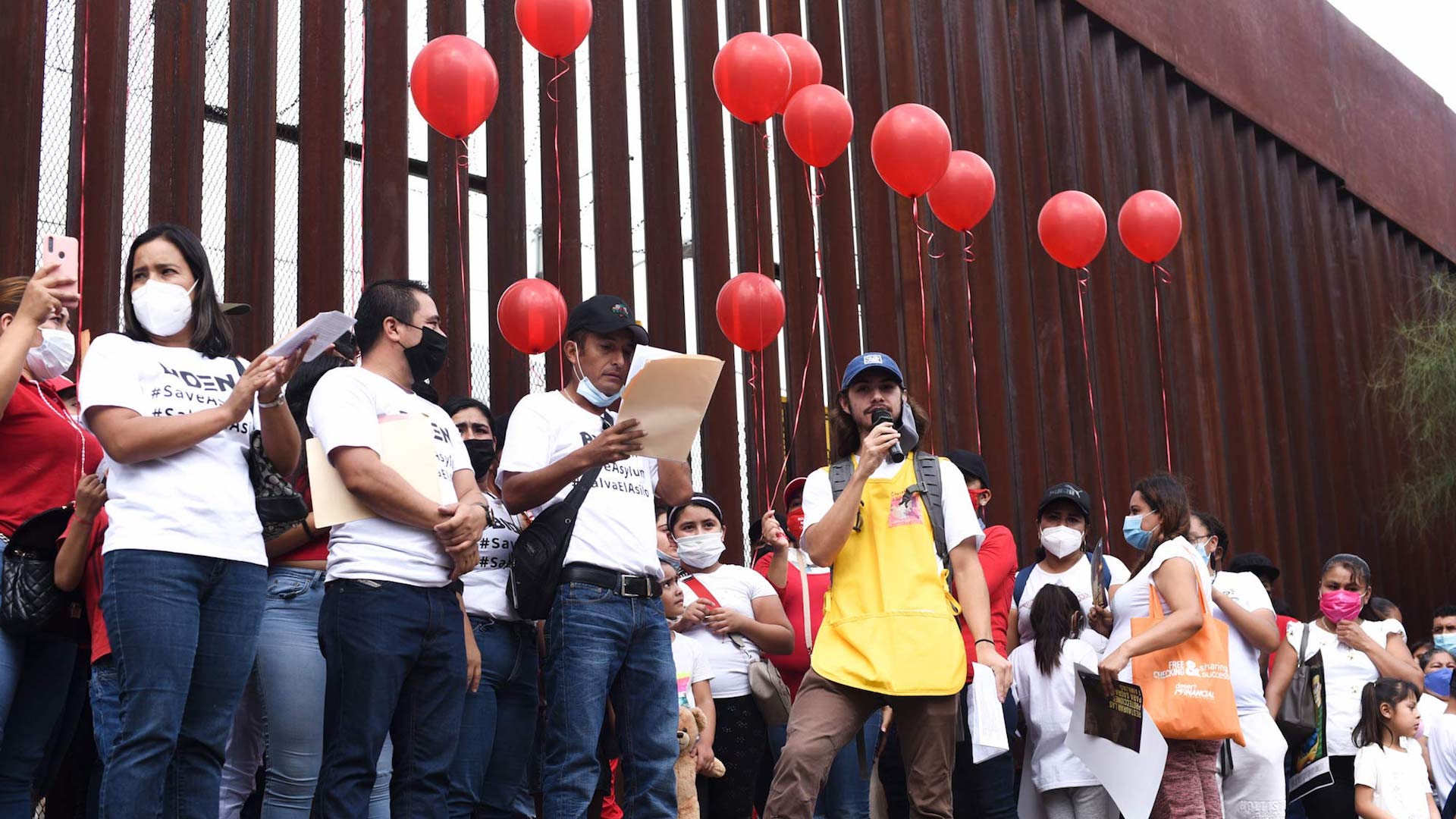 Migrants, advocates and faith leaders gather on both sides of the border wall in Nogales to read out the names of families seeking asylum and give testimonies. 