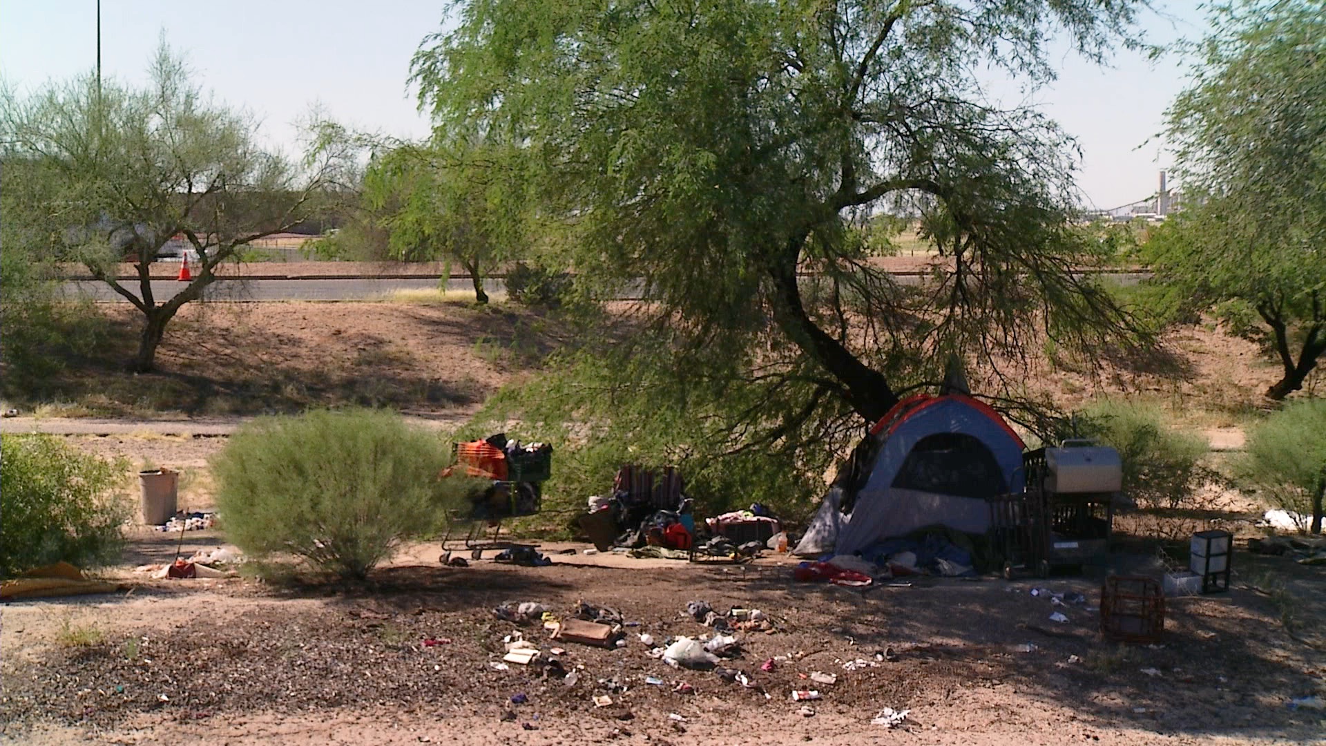 Items scattered about at a homeless encampment near Golf Links Road in Tucson.