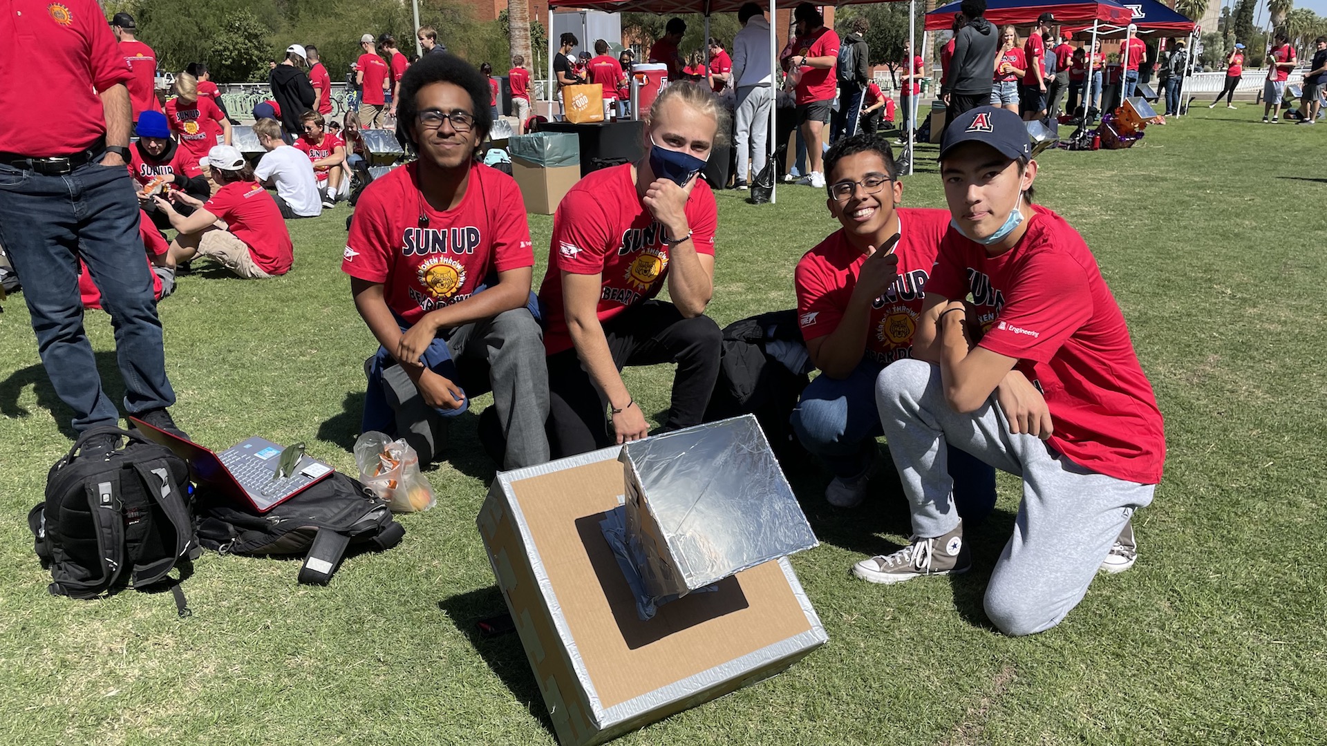 University of Arizona Engineering students Joseph White, Levi Mccluskey, Osamah Bahamid and Eric Anthony Pineda pose in front of their solar oven on Wednesday, October 13th, 2021, as part of the school's annual "Solar Oven Throwdown" event. 