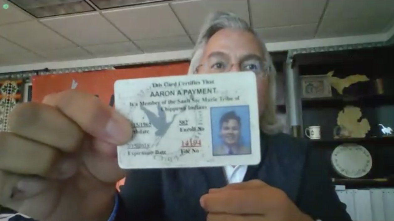 Aaron Payment of the National Congress of American Indians displays an old tribal ID card during a Senate Committee on Indian Affairs' oversight hearing October 27,2021.