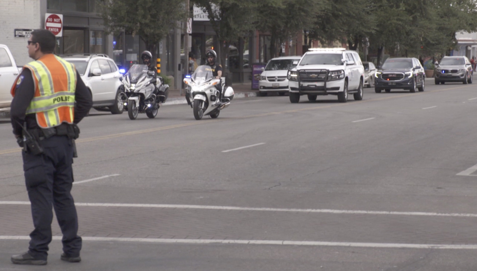 Police escort a vehicle carrying the body of Drug Enforcement Administration Group Supervisor Michael G. Garbo on Tuesday, October 5, 2021 after he was killed during a shootout at the Amtrak train station in downtown Tucson.