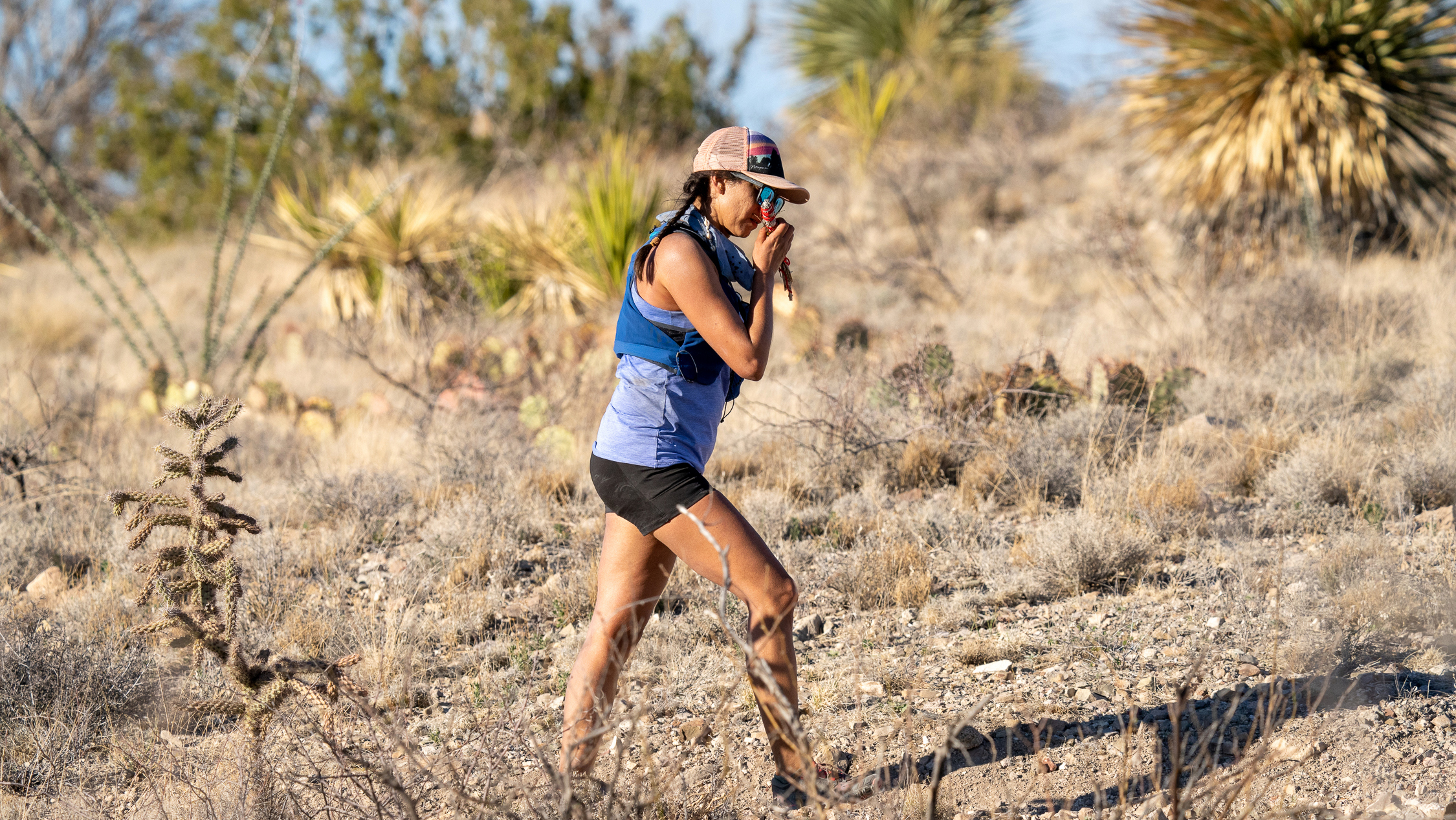 A still of Lydia Jennings, Pascua Yaqui (Yoeme) and Huichol (Wixaritari), celebrating her 2020 graduation from the University of Arizona during her 50-mile-run dedicated to Indigenous scientists. Her run is documented in Patagonia's Run To Be Visible episode. 