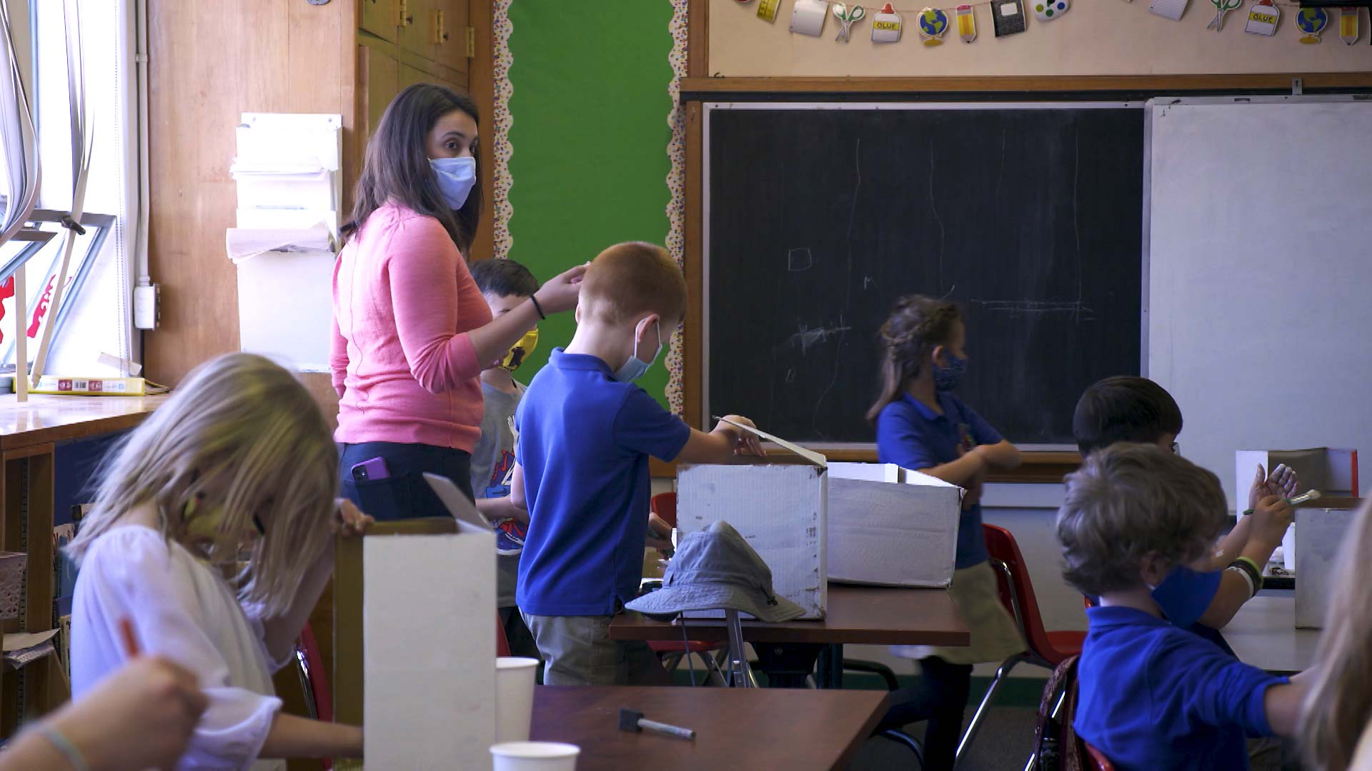 A teacher and students all wear masks while in the classroom at the International School of Tucson. February 2021.