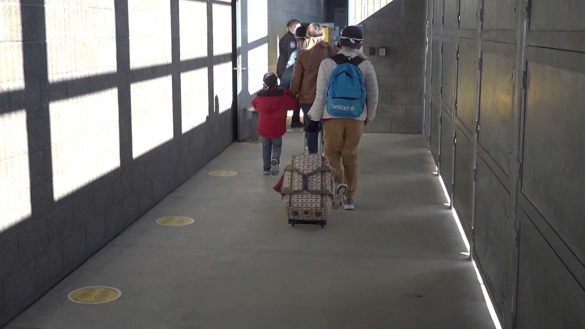 Immigrants with active cases under the Migrant Protection Protocols travel through the San Ysidro Port of Entry in San Diego as they are processed for entry into the United States. February 2021. 