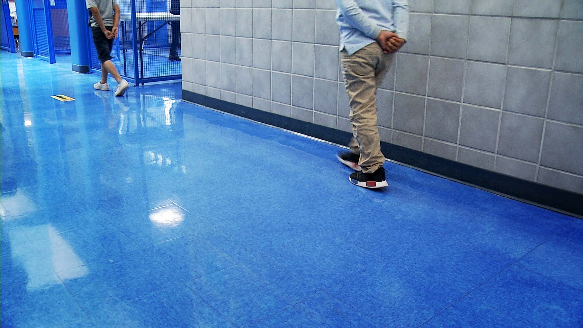 Students at Los Amigos Elementary in the Sunnyside Unified School District walk in a hallway at a distanced pace. March 2021. 