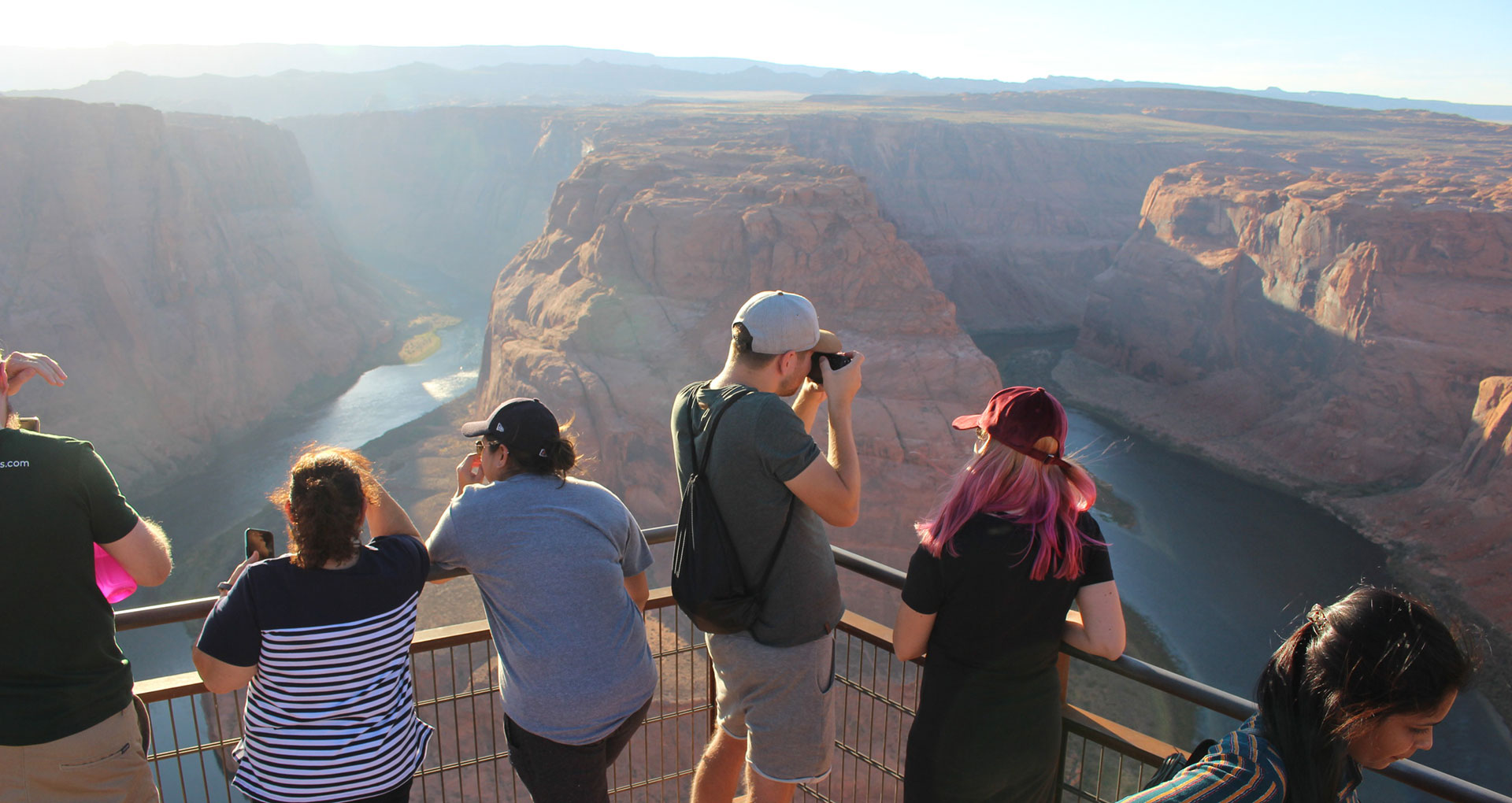 Visitors take in Colorado River views at Horseshoe Bend outside Page, Arizona. 