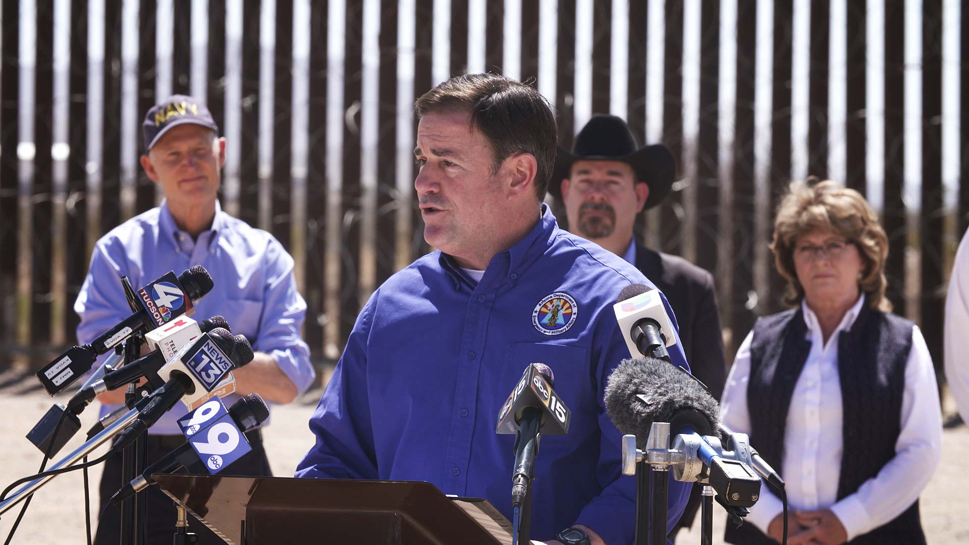 Arizona Gov. Ducey speaks to reporters at a news conference held along the border in Douglas on March 19, 2021. 