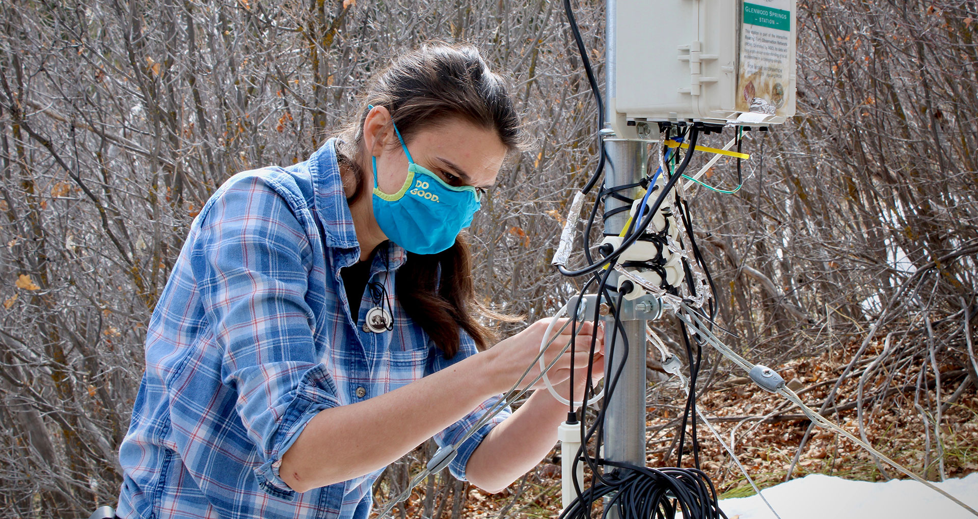Elise Osenga maintains one of Aspen Global Change Institute's 10 soil moisture monitors. Researchers use data from stations like this one to figure out how much snowmelt and precipitation will reach rivers and streams. 