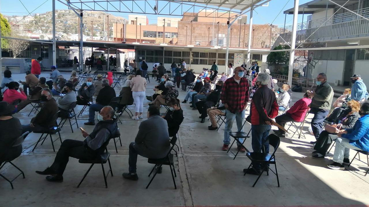 Recently vaccinated residents of Nogales, Sonora, wait while being monitored for possible side effects on March 11, 2021.