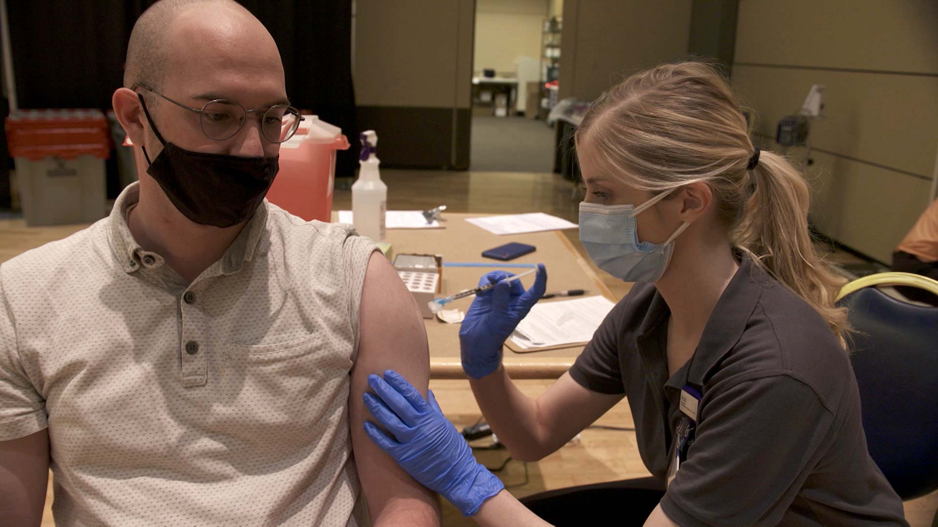 University of Arizona student Blake Gerken receives a dose of Moderna's COVID-19 vaccine at the campus's Student Union Memorial Center on April 16, 2021 as a participant in a nationwide vaccine study involving more than 20 universities.