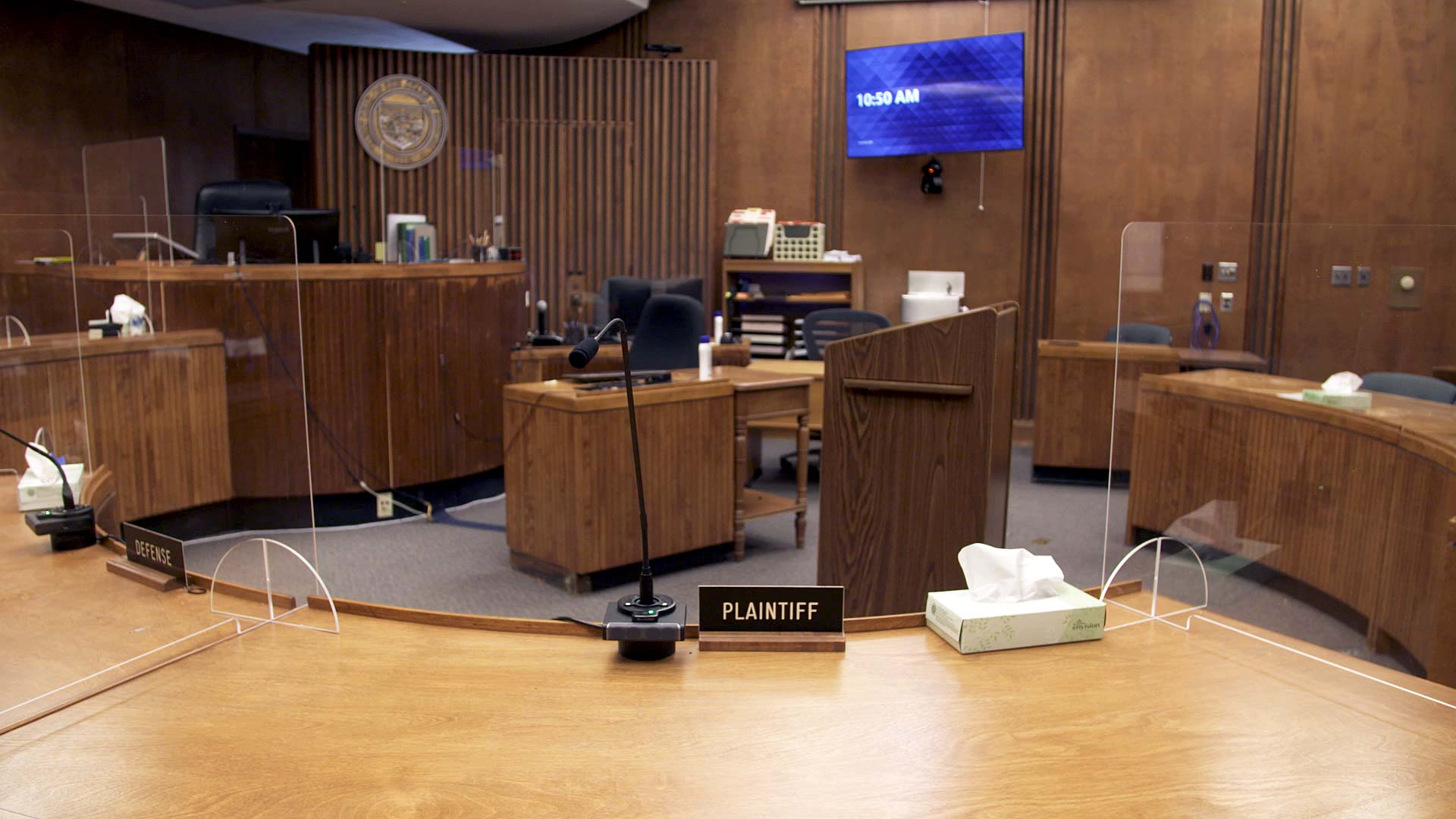 Plexiglass dividers are set up throughout a courtroom at the Pima County Superior Court as part of the building's COVID-19 mitigation protocols. April 2021. 