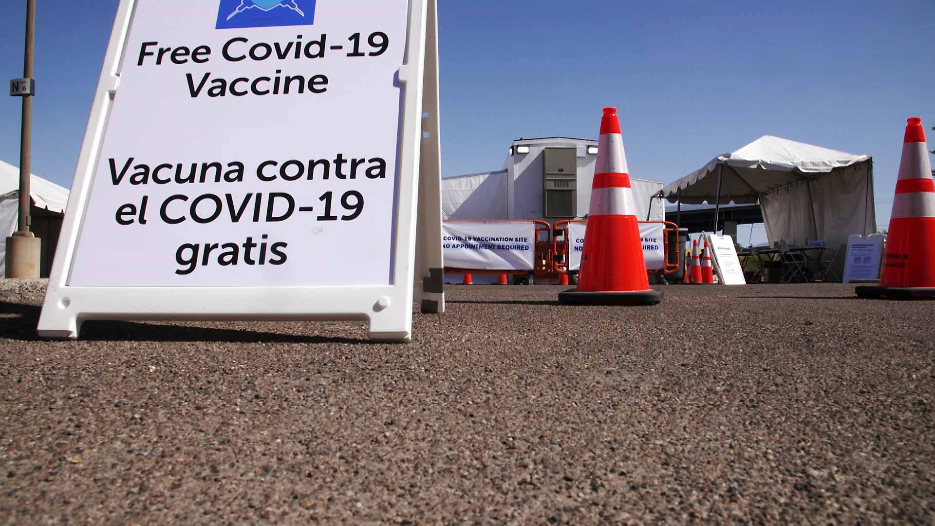 A sign advertising free COVID-19 vaccines at a mobile vaccination unit operated by FEMA at Pima Community College's Desert Vista Campus on May 3, 2021. 