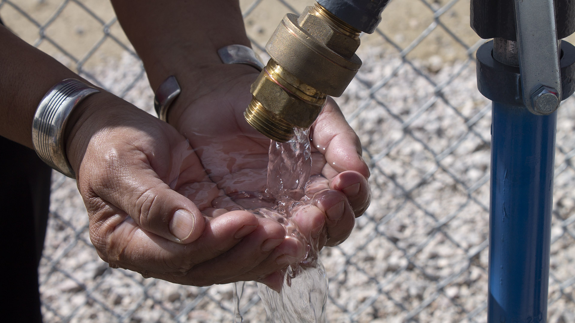 Member of the Navajo Nation retrieving clean, drinking water at the local well during the COVID-19 pandemic.