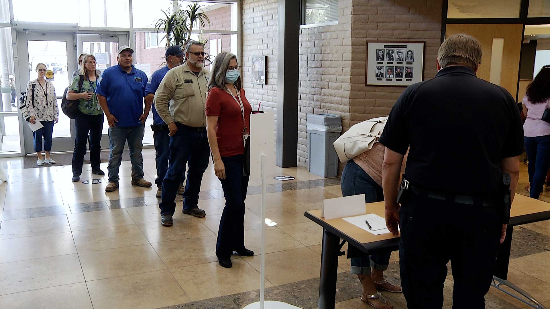 A line of people wait to check in at the Tucson Police Department's Active Killer Preparedness Training on July 26,2021. The trainings are mandatory for city employees but are also offered to the public. 