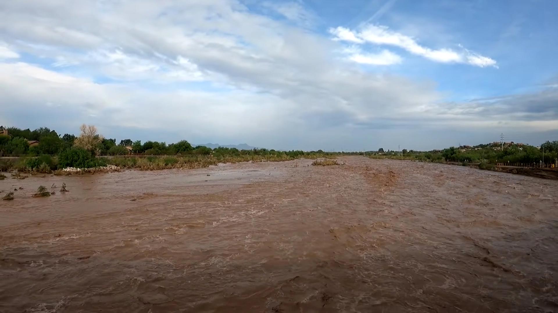 Waters from monsoon storms filled the Rillito River. July 2021. 