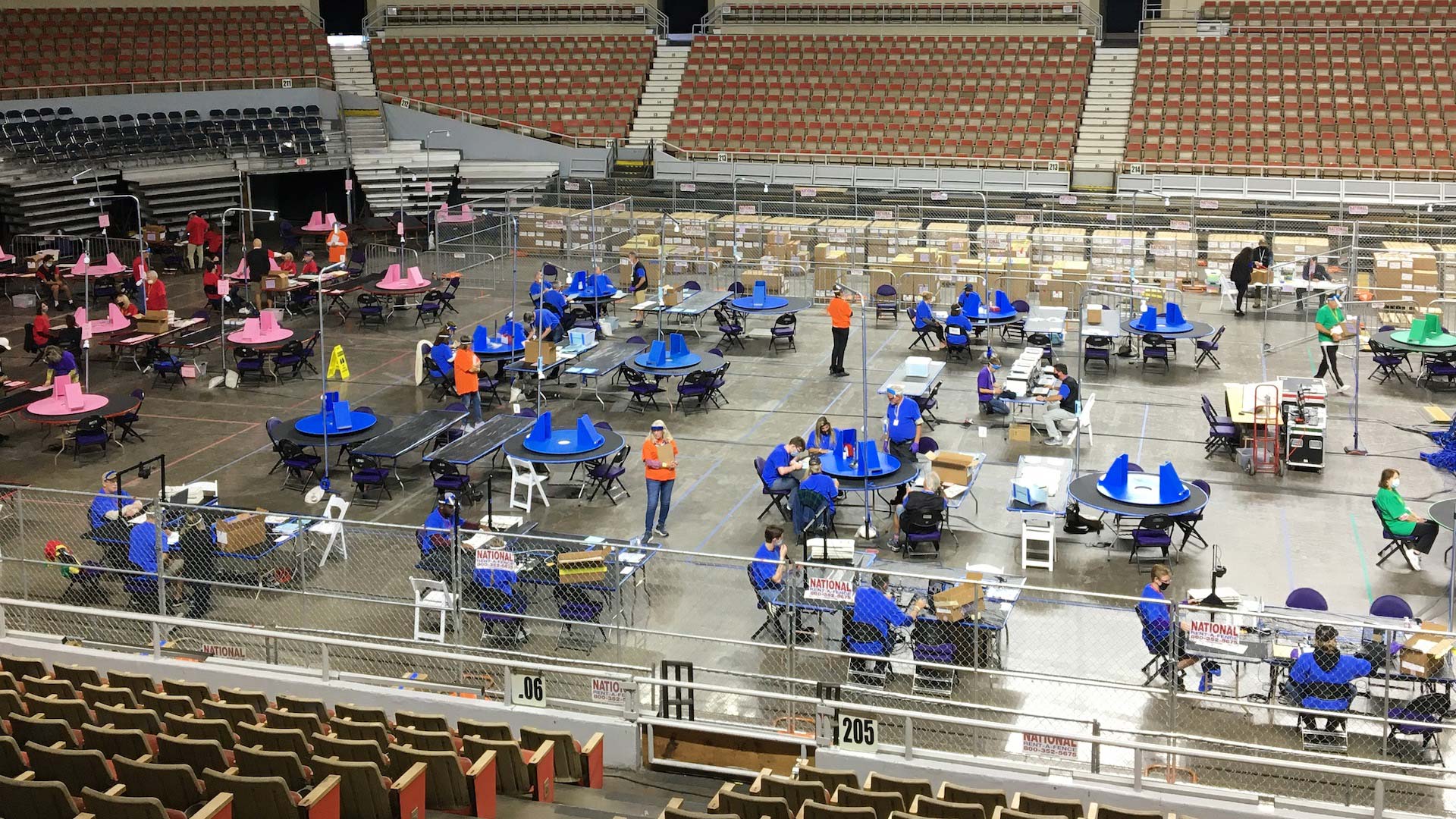 The Arizona Senate's contractors count ballots from Maricopa County inside the Veterans Memorial Coliseum during May 2021.