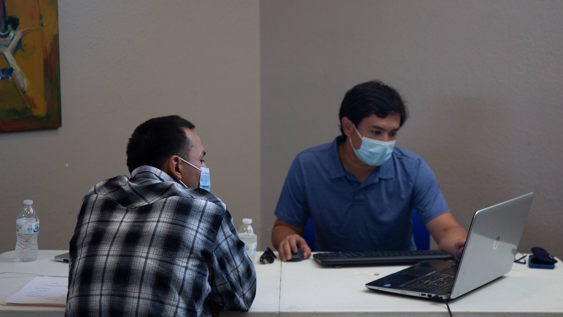 Joel talking with Sen Umeda, a lawyer volunteering with Arizona NORML, during an expungement clinic for low-level marijuana offenses July 31, 2021.