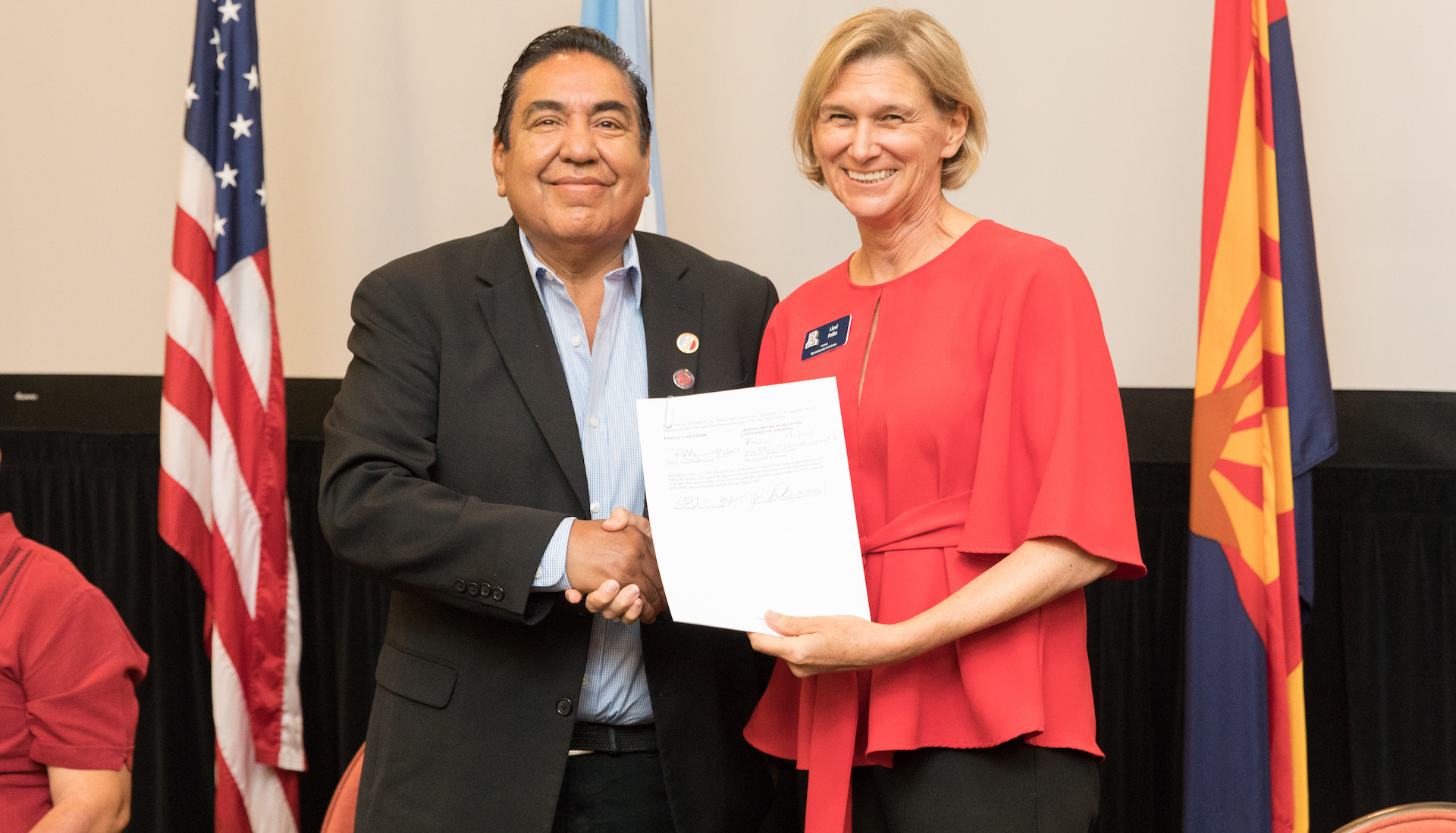 Pascua Yaqui Chairman Peter Yucupicio and Senior Vice President for Academic Affairs and Provost Liesl Folks at the signing of the intergovernmental agreement in August.