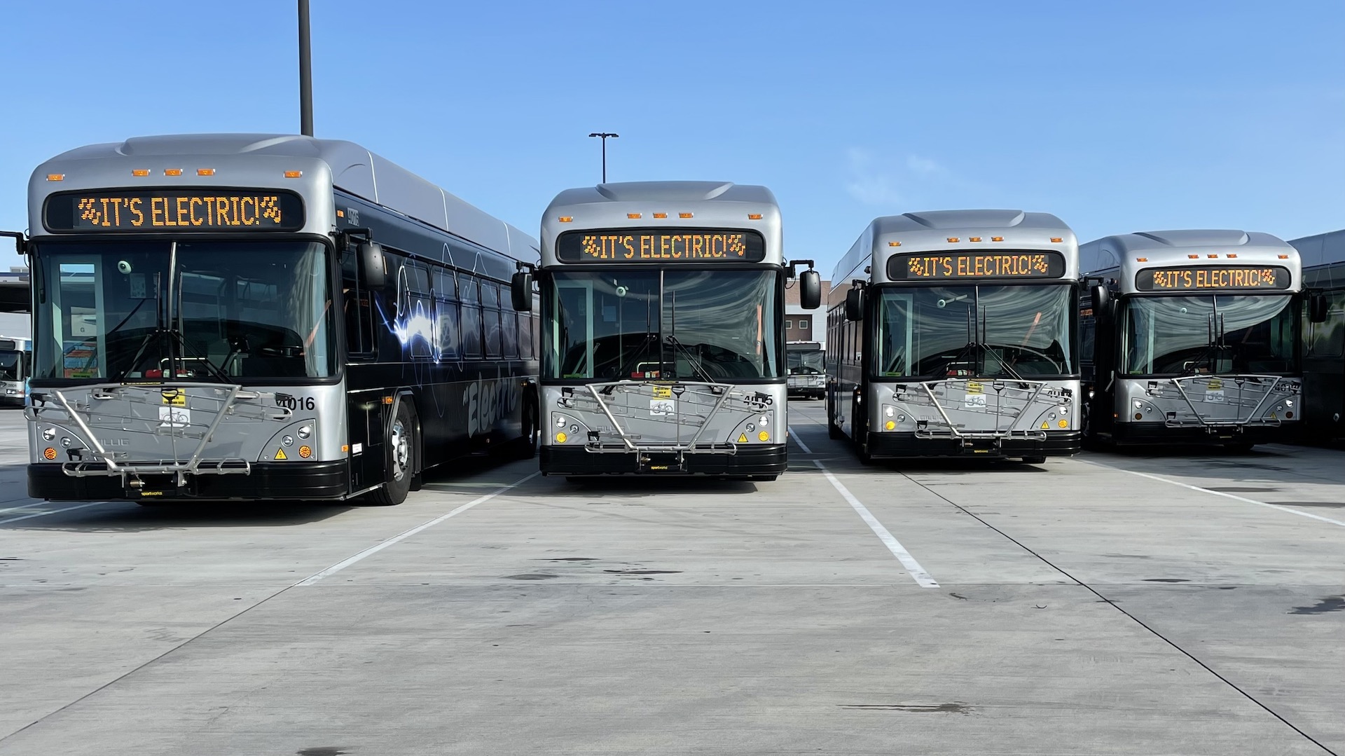 Four of Tucson's five new electric buses sit at a Sun Tran depot. They were unveiled on September 30th, 2021. 