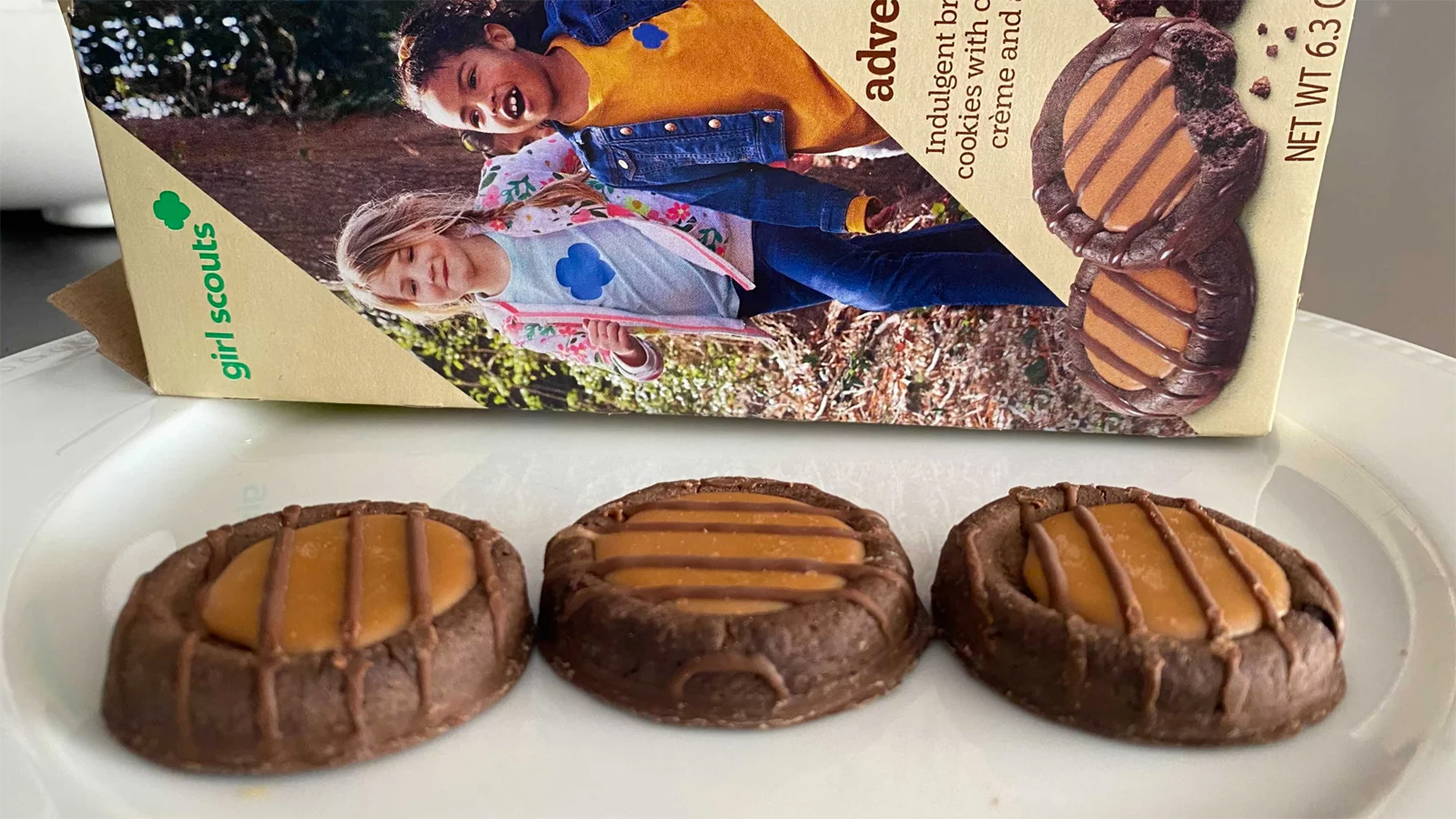 The newest Girl Scout cookie, Adventurefuls, has fallen victim to supply chain and labor disruptions. The brownie-inspired treat features a caramel-flavored creme and a dash of sea salt.