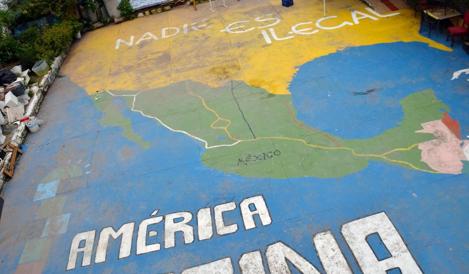 A map of North and Central America on the patio outside the El Refugio migrant shelter in Guadalajara, Mexico, says "Nobody is illegal."