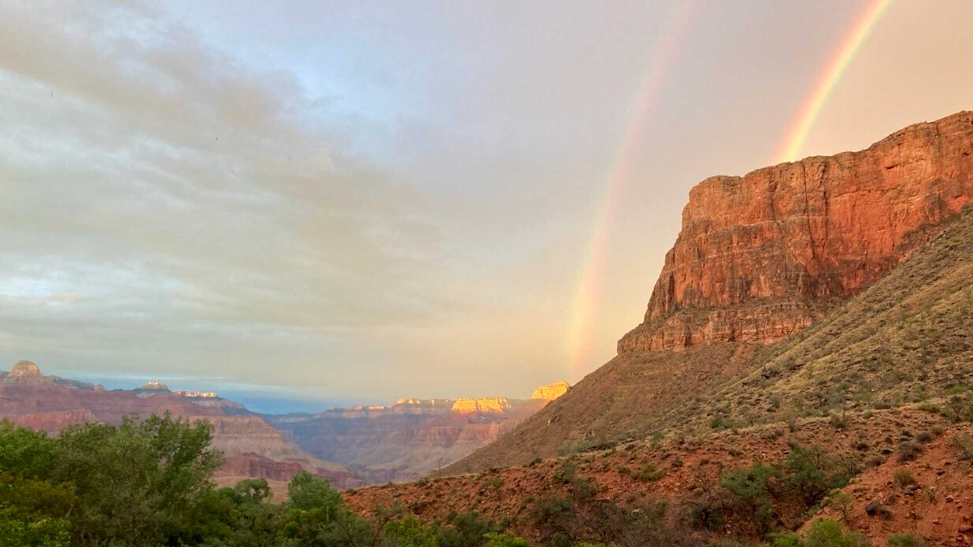 This August 2022 photo provided by the National Park Service shows a double rainbow from the ranger station porch at Indian Garden, which is now called Havasupai Gardens, in Grand Canyon National Park. The Indian Garden name assigned to a popular Grand Canyon campground has been changed out of respect for a Native American tribe that was displaced by the national park. The Havasupai Tribe and Grand Canyon National Park announced Monday, Nov. 21, that Indian Garden will be renamed Havasupai Gardens.
