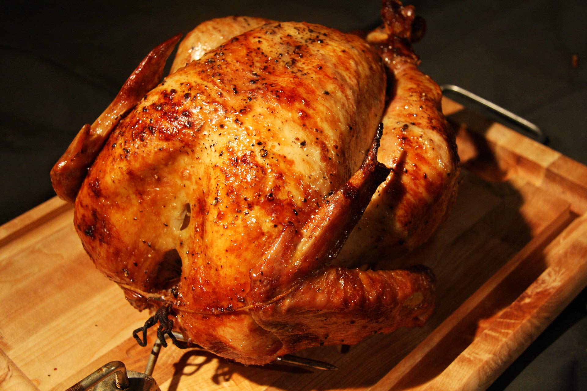 A rotisserie turkey cooked to a golden brown.