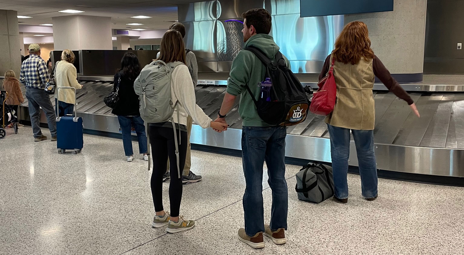 Passengers wait to pick up their luggage at Tucson International Airport in November 2022. 