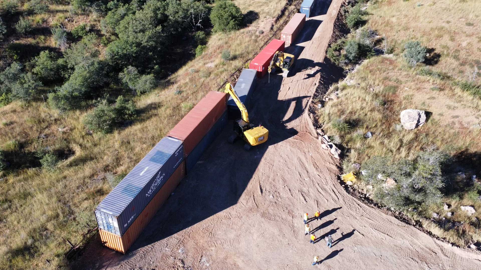 Shipping containers are put in place along the U.S.-Mexico border in Cochise County. 