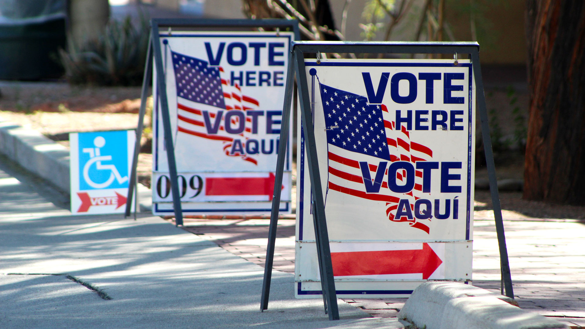 Two "Vote Here" signs sit outside the Armory Park Center on Tuesday, Nov. 8, 2022 in downtown Tucson.