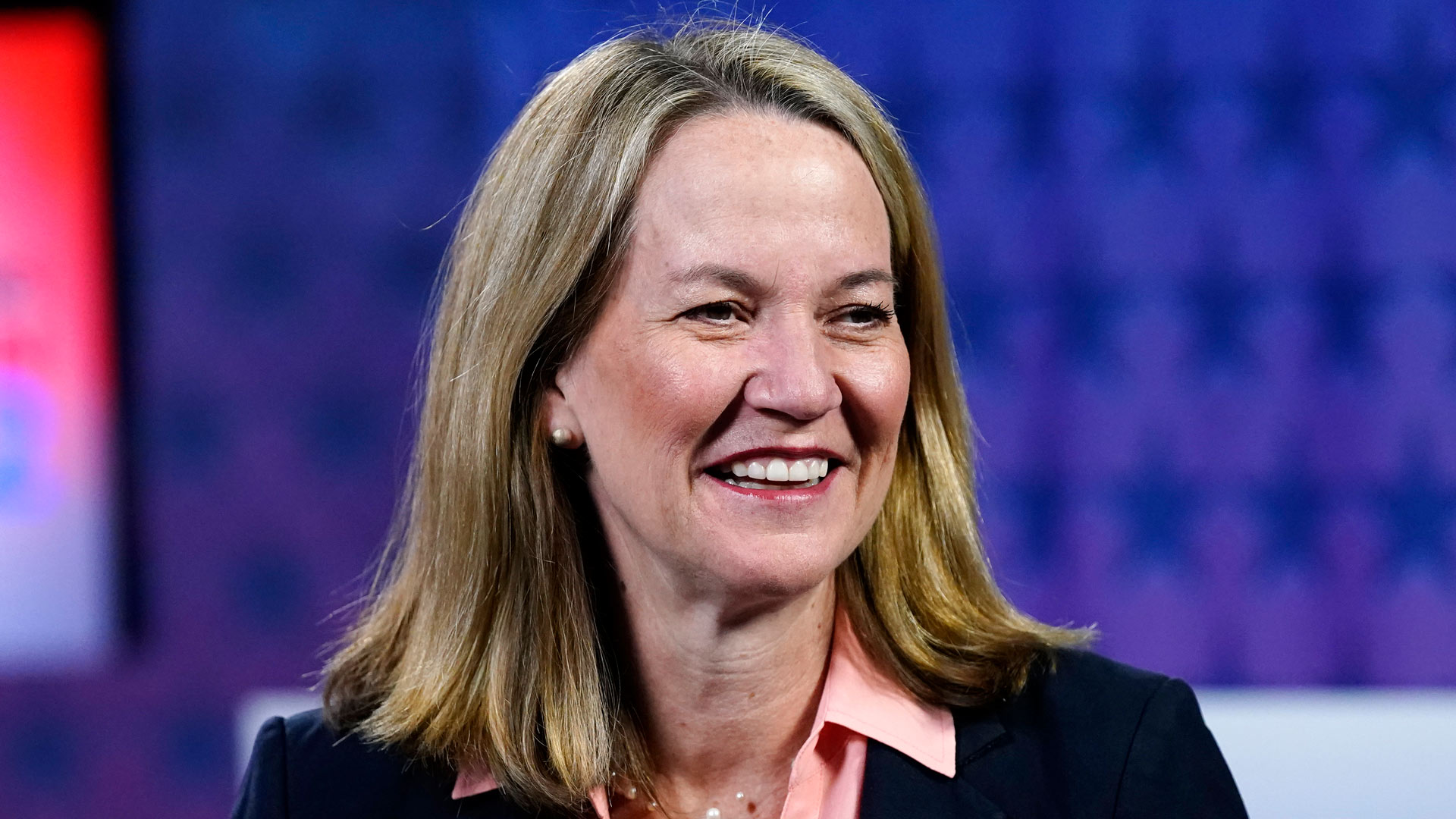 Kris Mayes, a Democratic candidate for Arizona attorney general, smiles before a debate against Republican Abraham Hamadeh on Sept. 28, 2022.