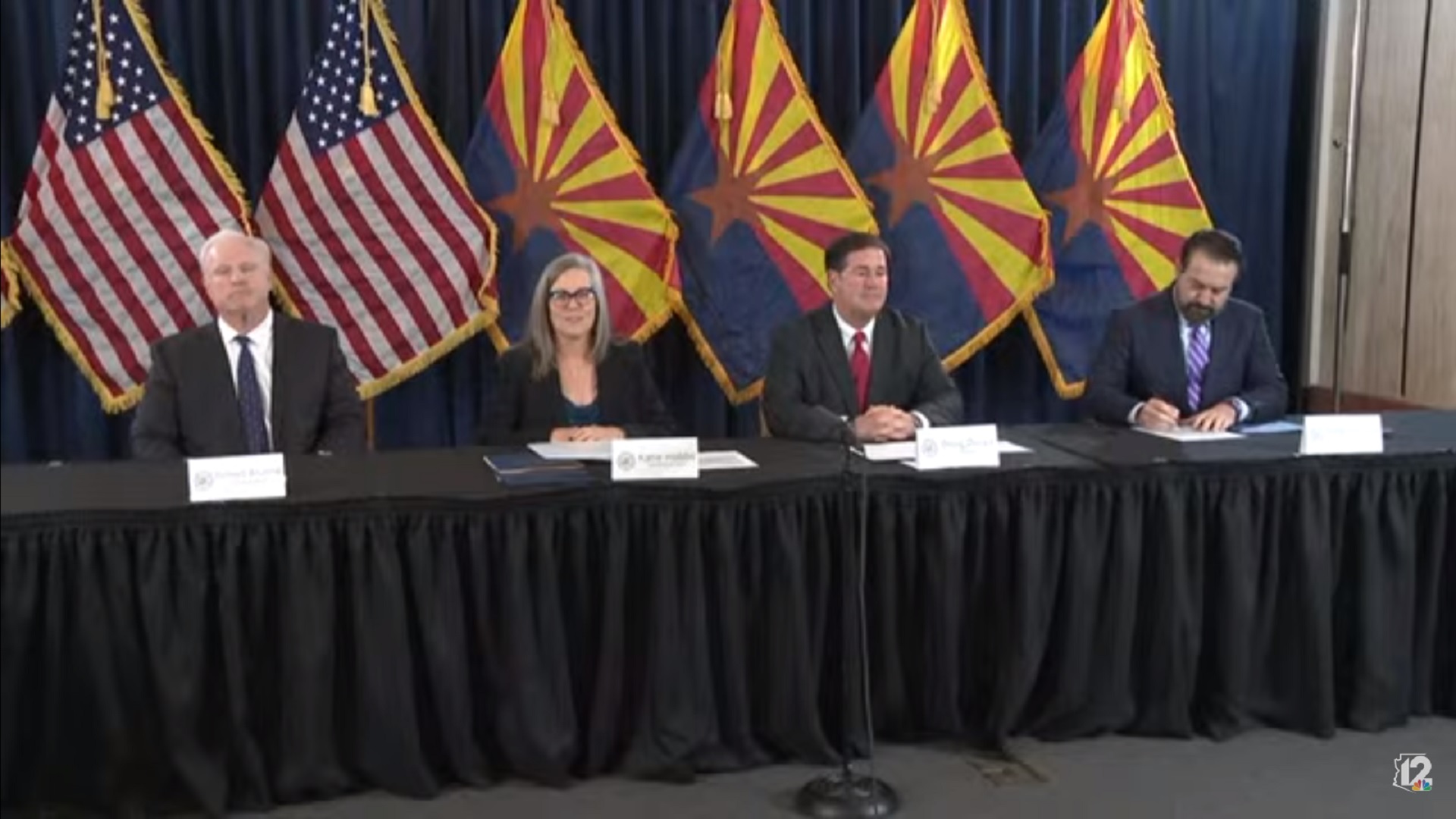 Chief Justice Robert M. Brutinel, Secretary of State Katie Hobbs, Governor Doug Ducey, and Attorney General Mark Brnovich prepare to sign canvassing paperwork certifying the results of the 2022 general election at the state capitol on Monday December 5, 2022.