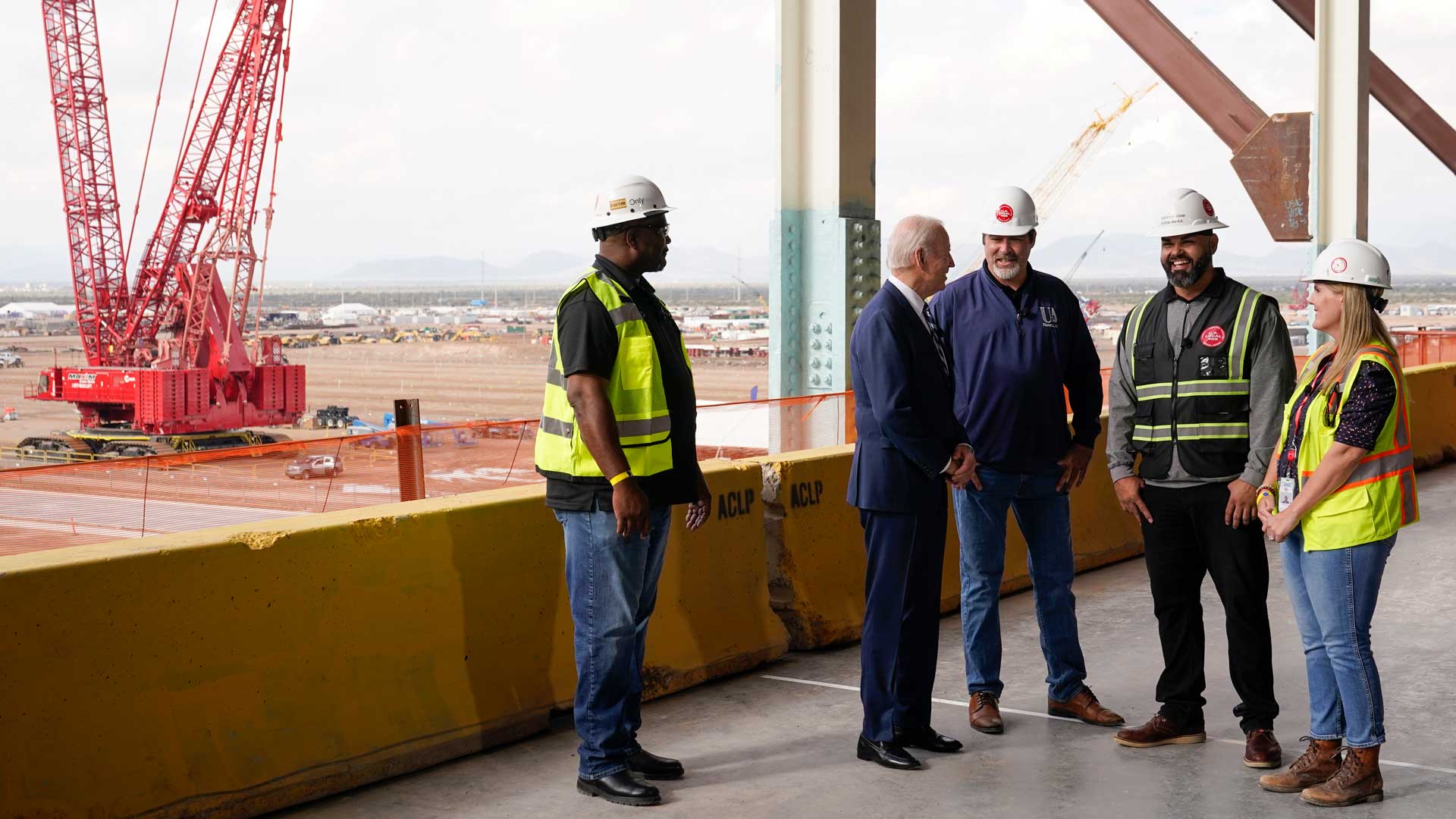 President Joe Biden tours the building site for a new computer chip plant for Taiwan Semiconductor Manufacturing Company, Tuesday, Dec. 6, 2022, in Phoenix. 