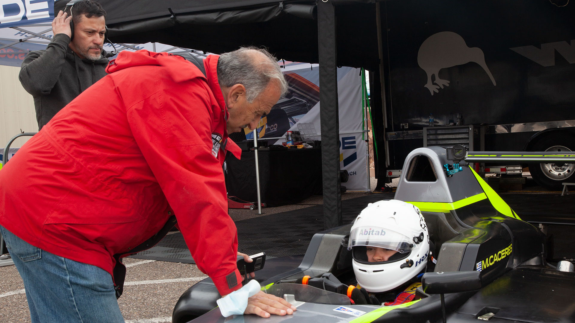 Driver Maite Caceres, of Uruguay, receives instructions.