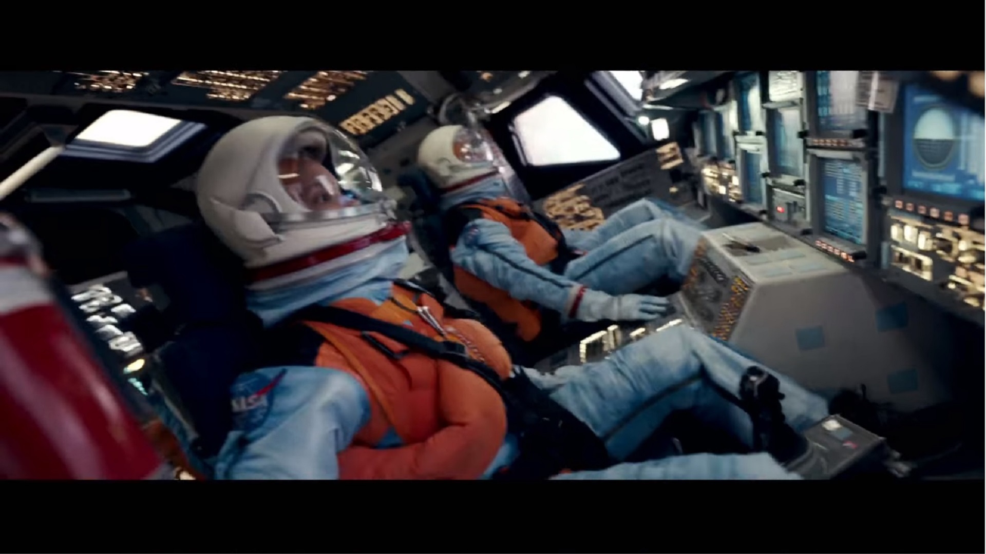A screenshot from the trailer for the movie Moonfall depicts a space shuttle crew at launch.  The set, a former NASA shuttle training simulator, is now on display at the Pima Air and Space Museum.