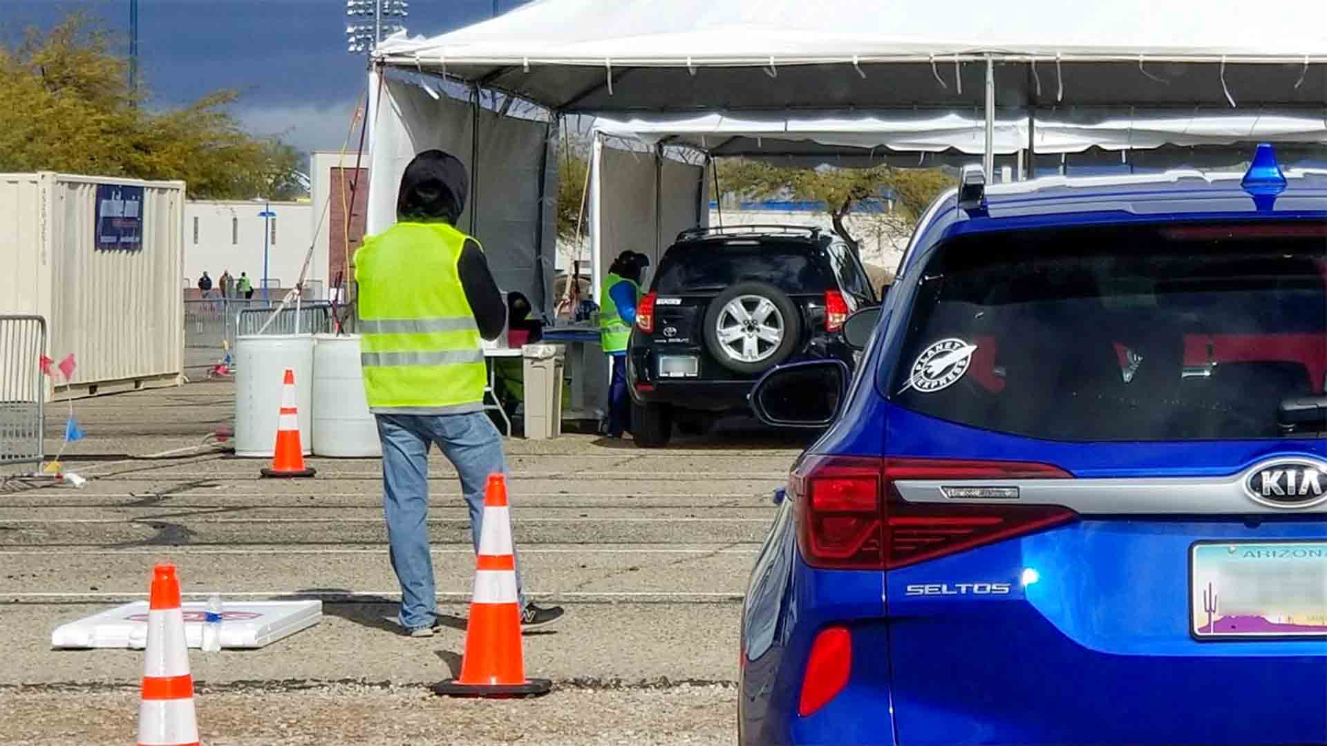 COVID-19 vaccinations are administered in a drive-up facility in Tucson, January 2021. 