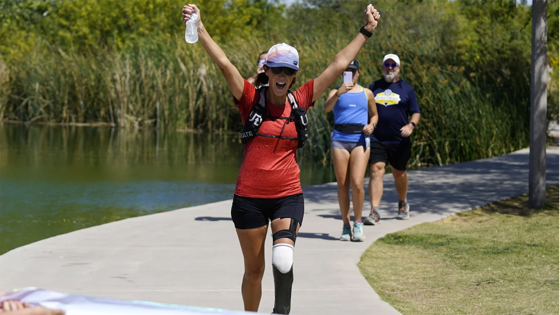 Jacky Hunt-Broersma finishes her 102nd marathon in 102 days last Thursday in Chandler, Ariz.