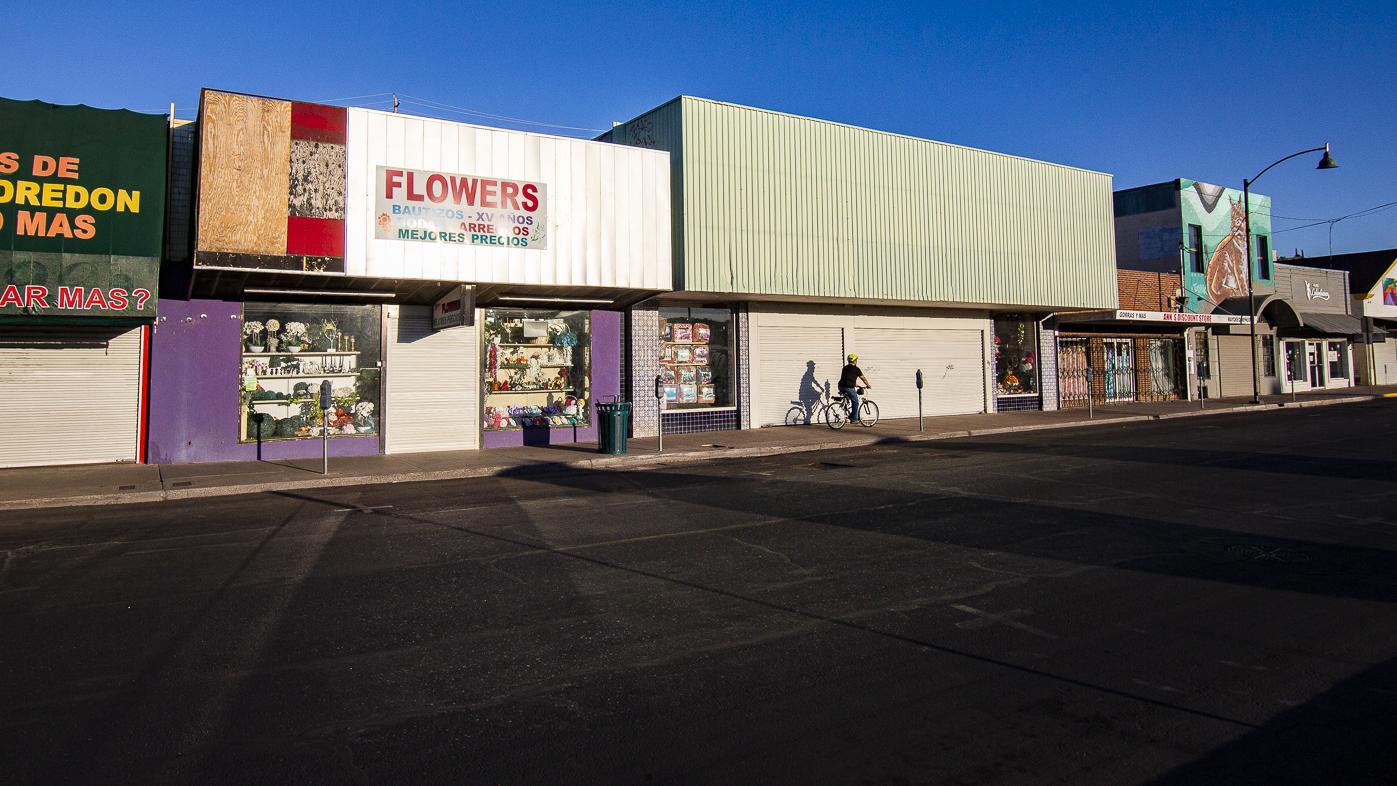 A bicyclist rides along Morley Avenue in downtown Nogales, Arizona, on a recent weekday afternoon.