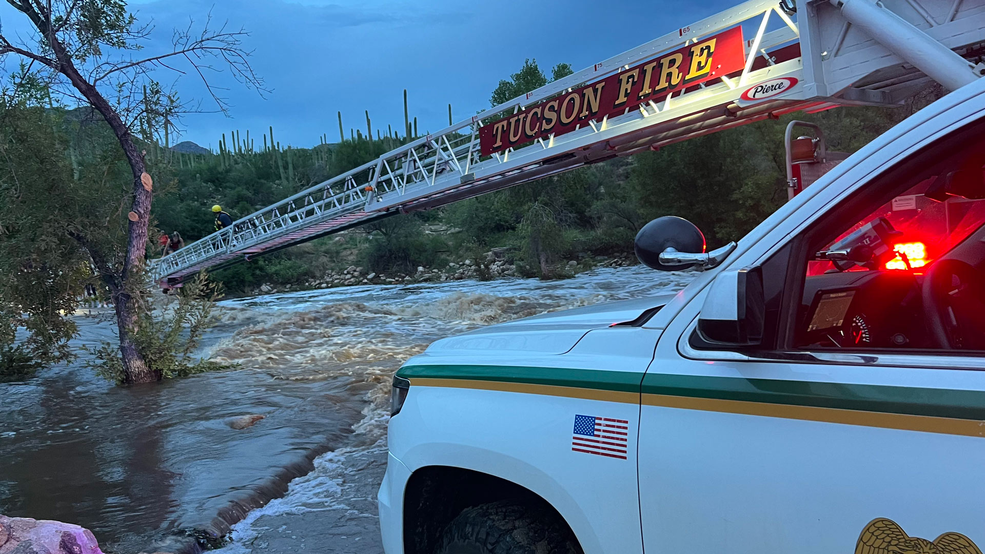 The Tucson Fire Department uses a ladder truck to work with the Coronado National Forest and Pima County SAR to rescue 25 people stuck in a flash flood in Bear Canyon. August 13, 2022