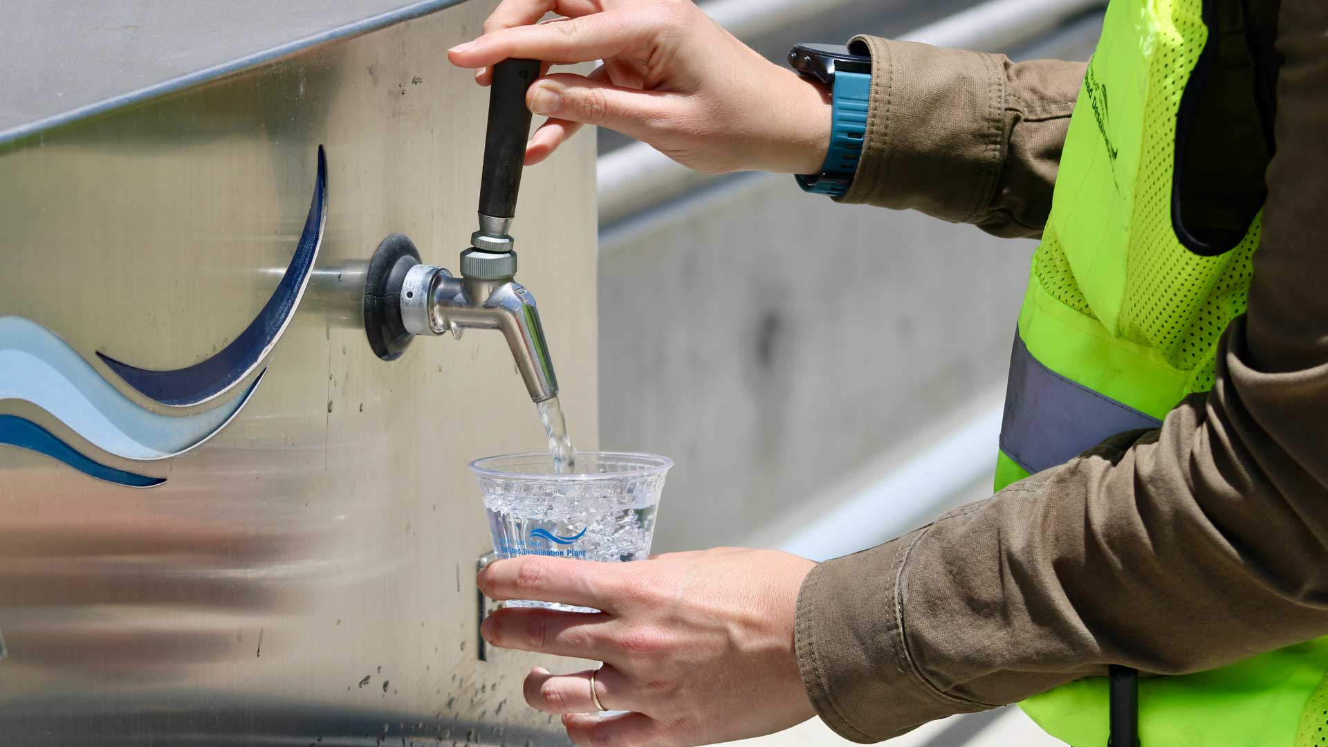 Michelle Peters fills a glass with freshly desalinated ocean water at Poseidon Water's Carlsbad plant. Using reverse osmosis, the facility creates about 10% of San Diego County's freshwater supply.
