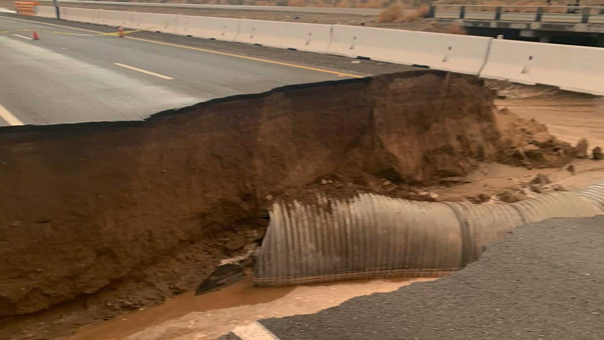 This photo provided by Caltrans shows a washed-out section of Interstate 10 near Desert Center, Calif., Wednesday, Aug. 24, 2022. Eastbound traffic on Interstate 10 in the Southern California desert was blocked Thursday after flash floods washed out the roadway. The latest round of flooding caused by monsoonal thunderstorms hit Wednesday evening and also impacted other desert highways. 