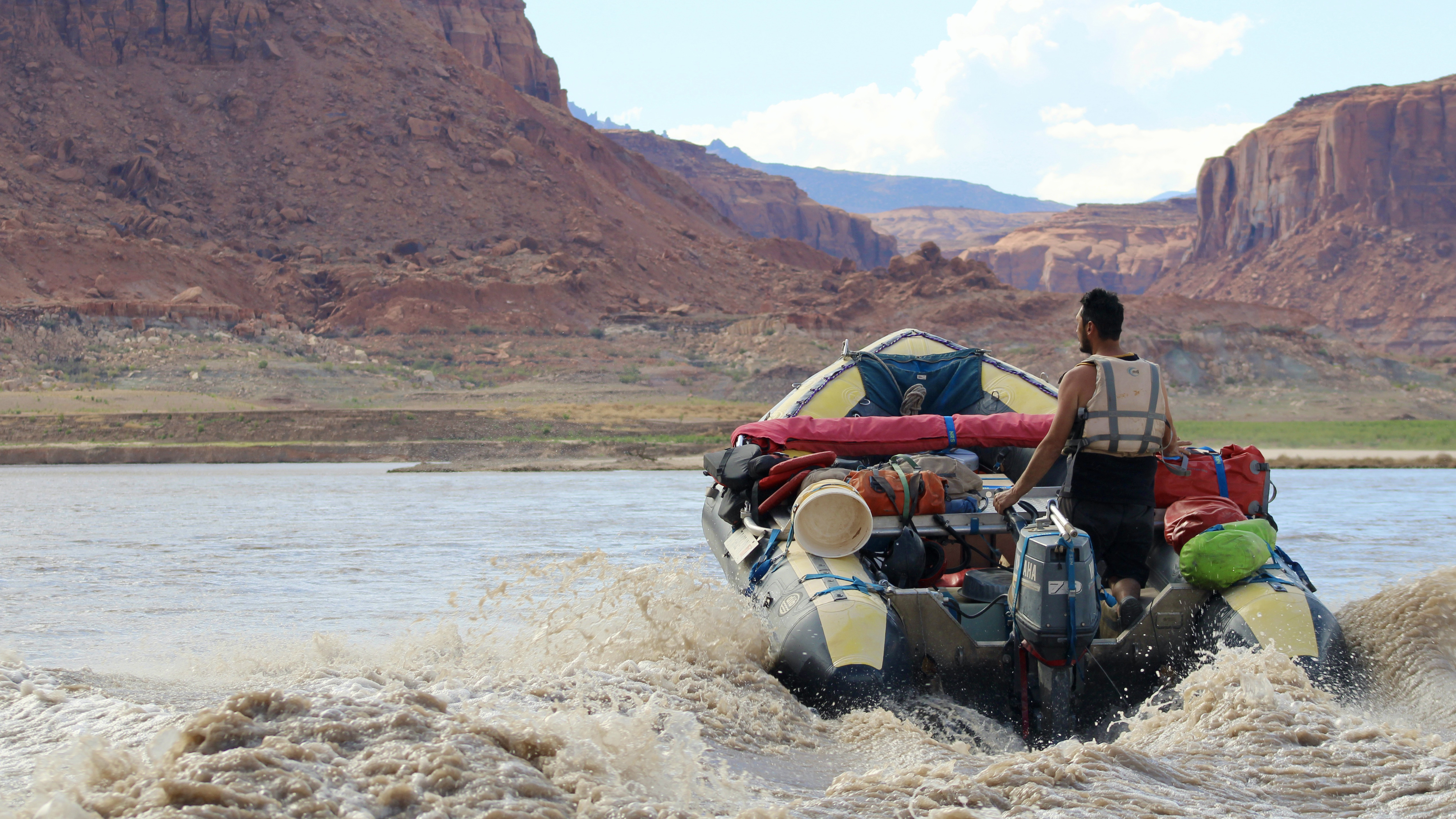 A rafting outfitter motors through Lake Powell's delta.
