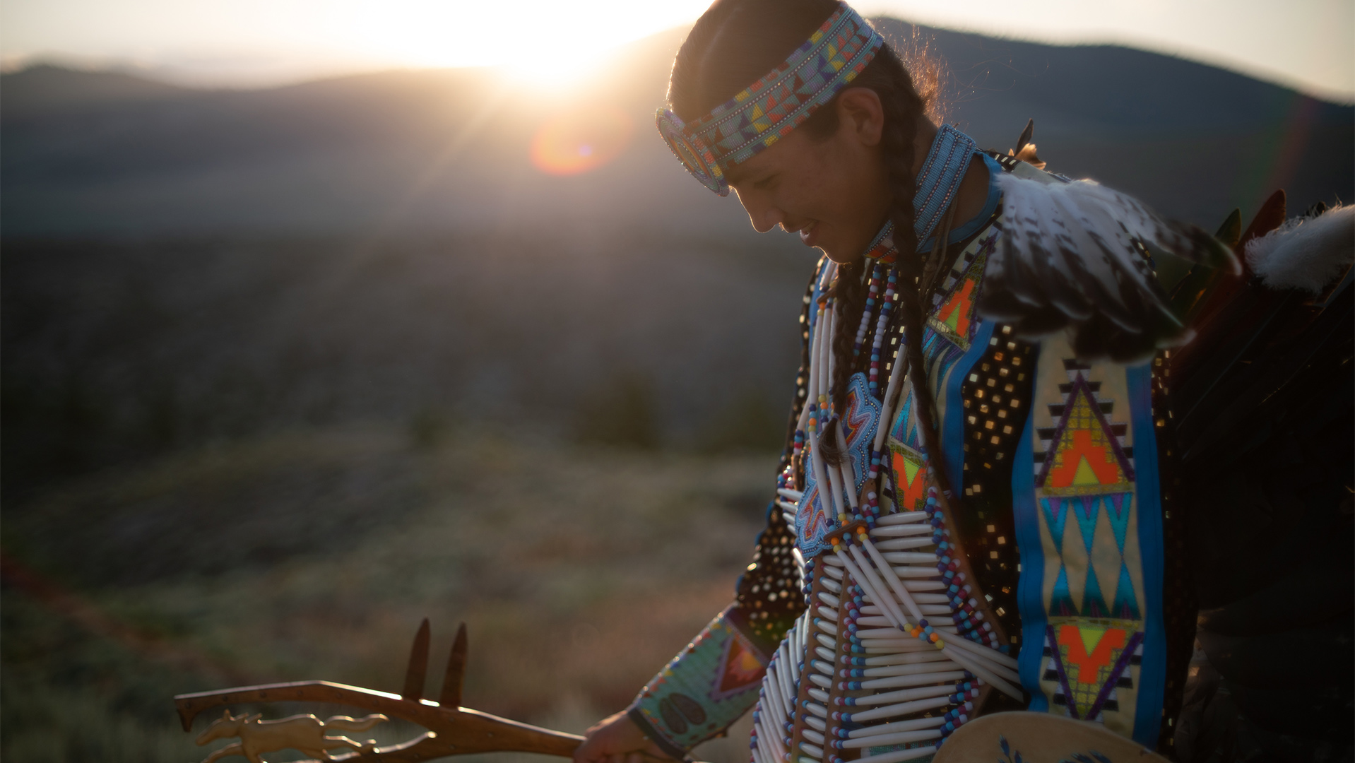 A traditional dancer on the Flathead Indian Reservation in Montana takes part in a pow wow. The Reservation has experienced a record number of deaths by suicide in recent years.