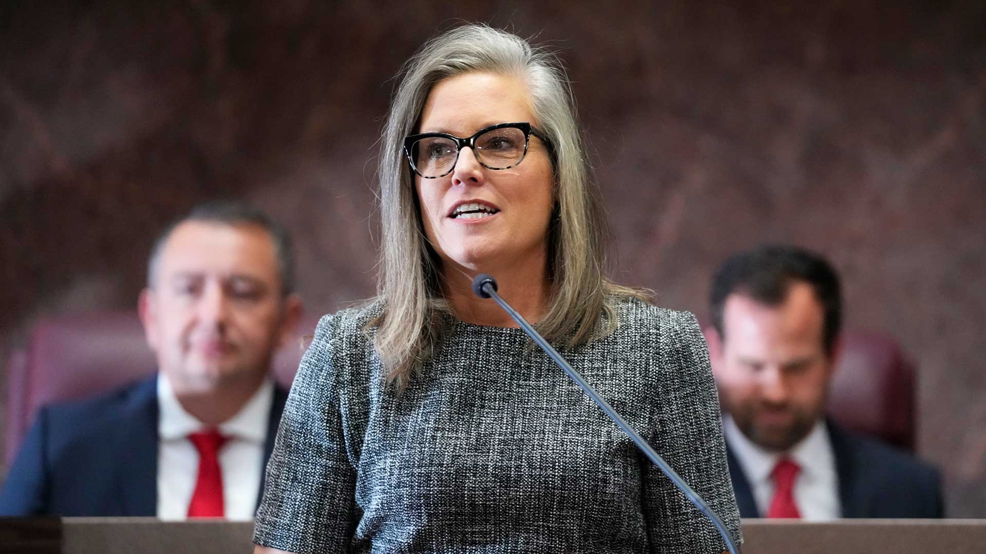 Democratic Arizona Gov. Katie Hobbs, center, is flanked by Arizona House Speaker Ben Toma, R-Glendale, left, and Arizona Senate President Warren Petersen, R-Gilbert, right, at Hobbs' state of the state address at the Arizona Capitol in Phoenix on Jan. 9, 2023.