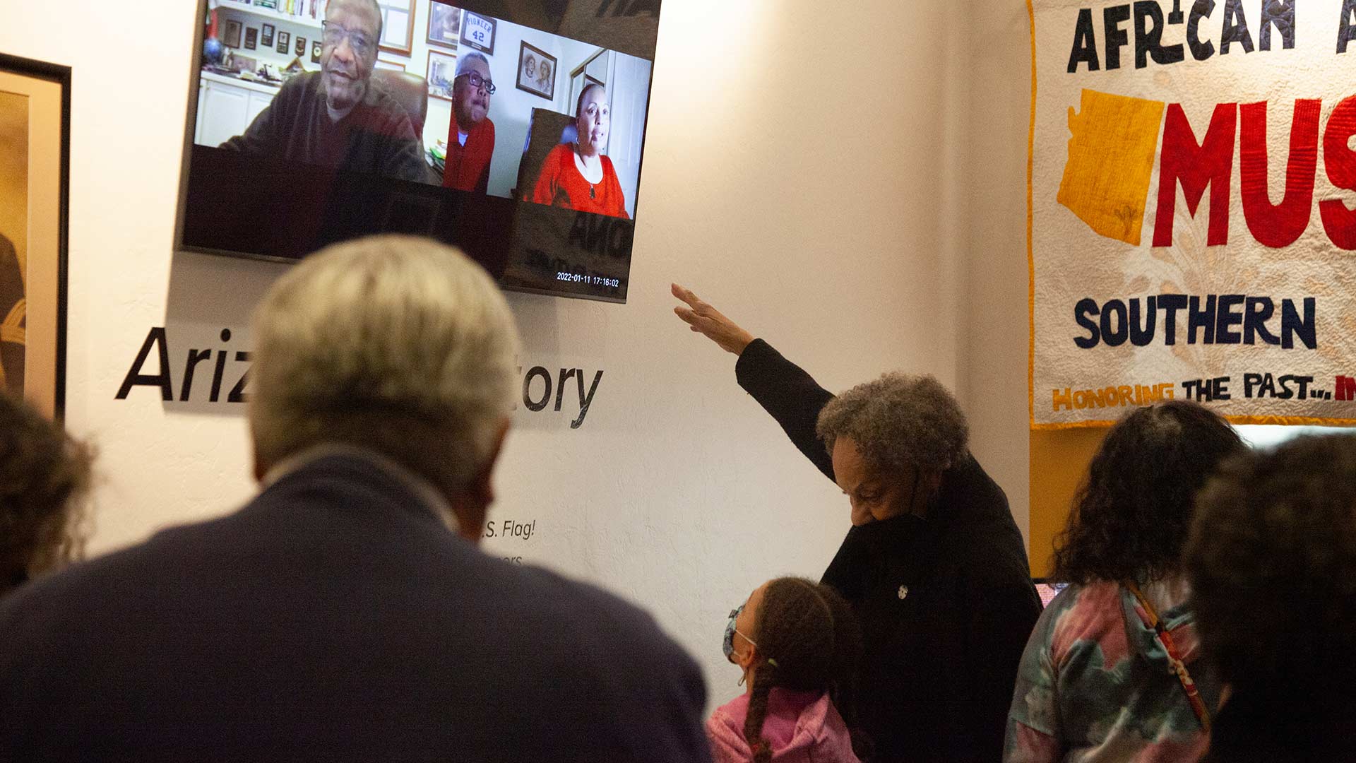 A woman teaching her granddaughter at the African American Museum of Southern Arizona